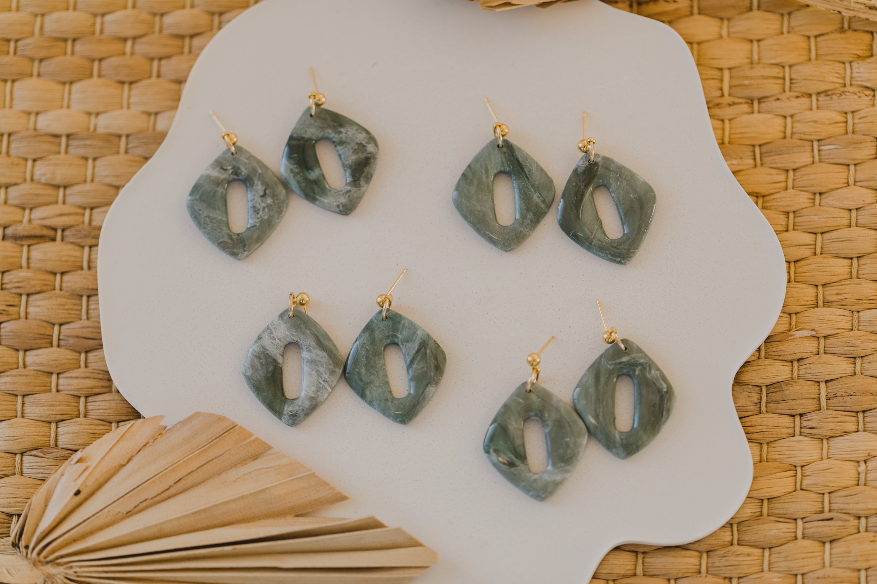 Hoop earrings with round polymer clay pendant and leaf