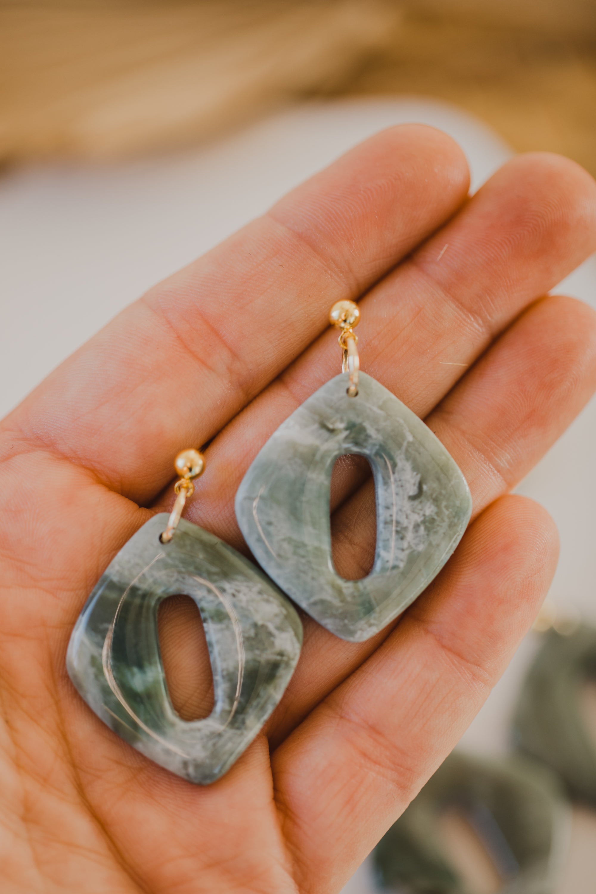Hoop earrings with round polymer clay pendant and leaf