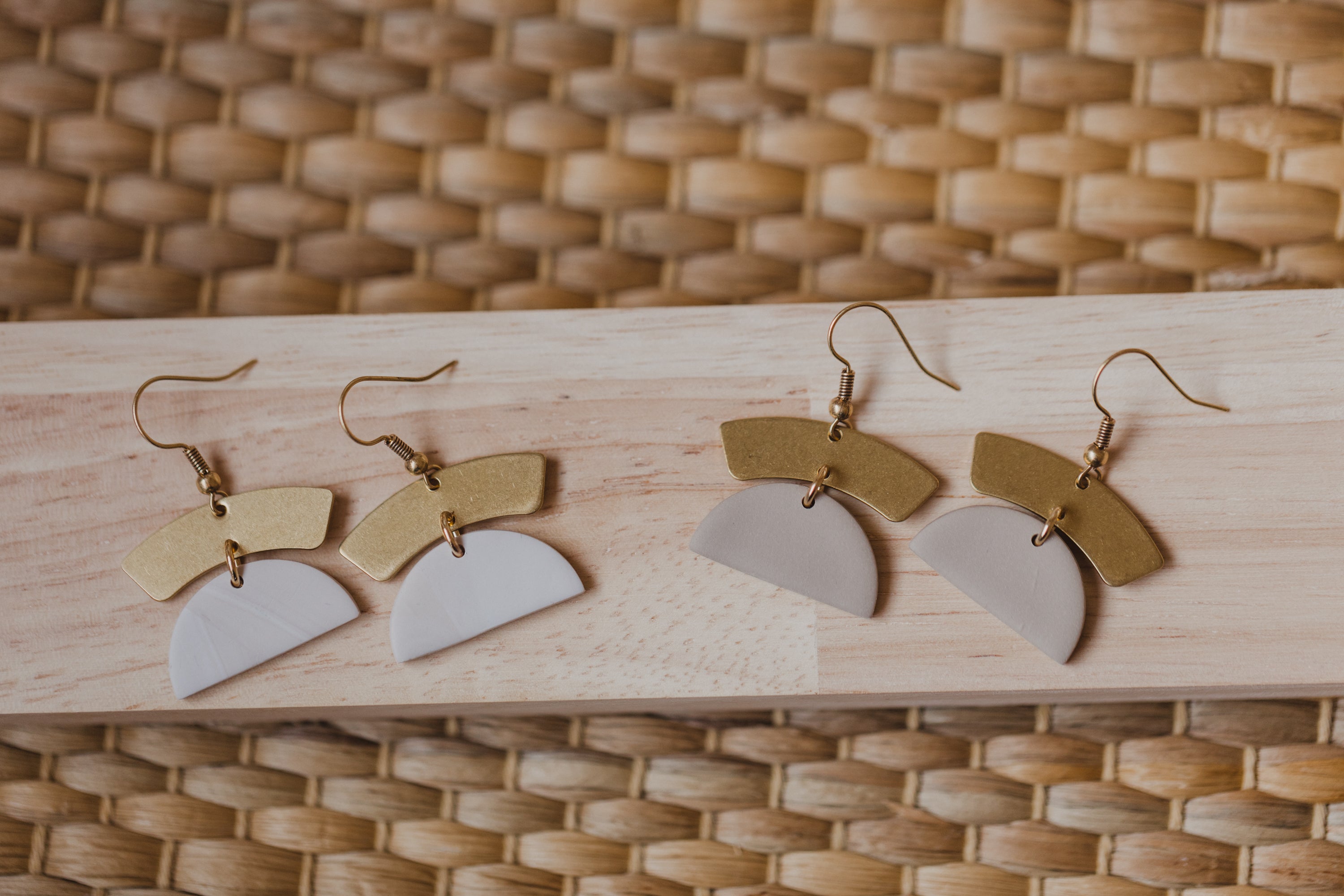 golden earrings with acrylic in white, petrol and brown