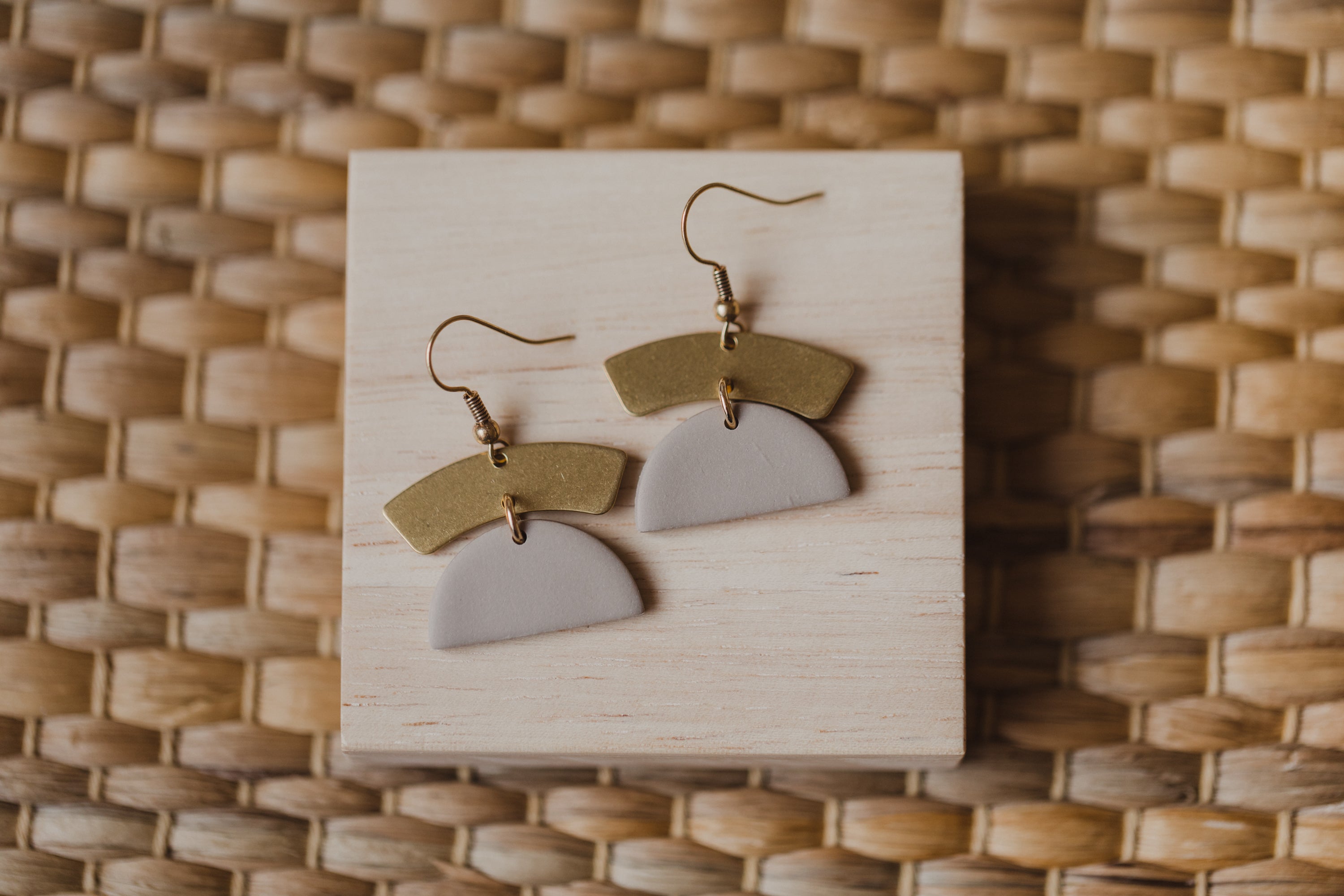 golden earrings with acrylic in white, petrol and brown