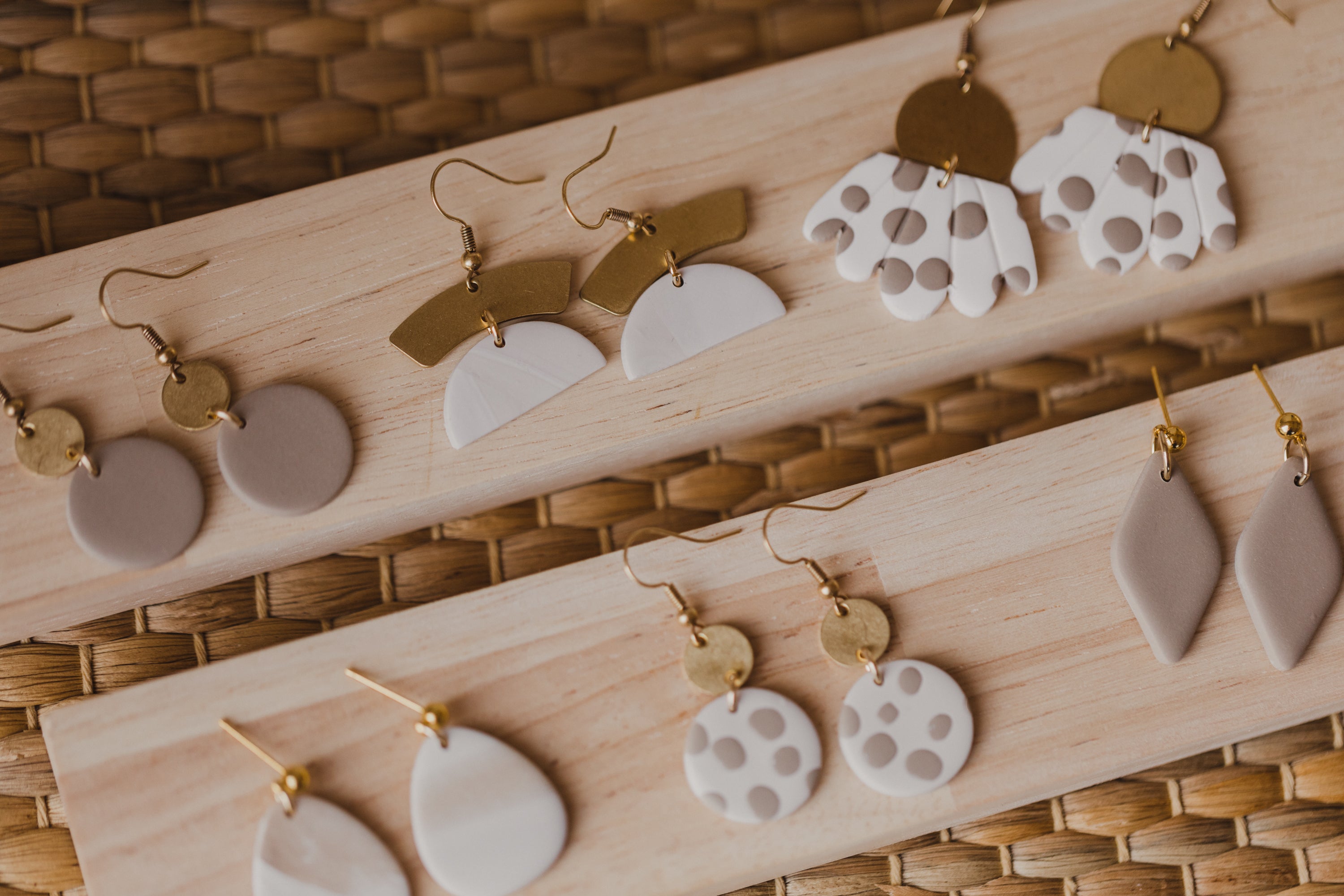 golden earrings with acrylic in white, petrol and brown