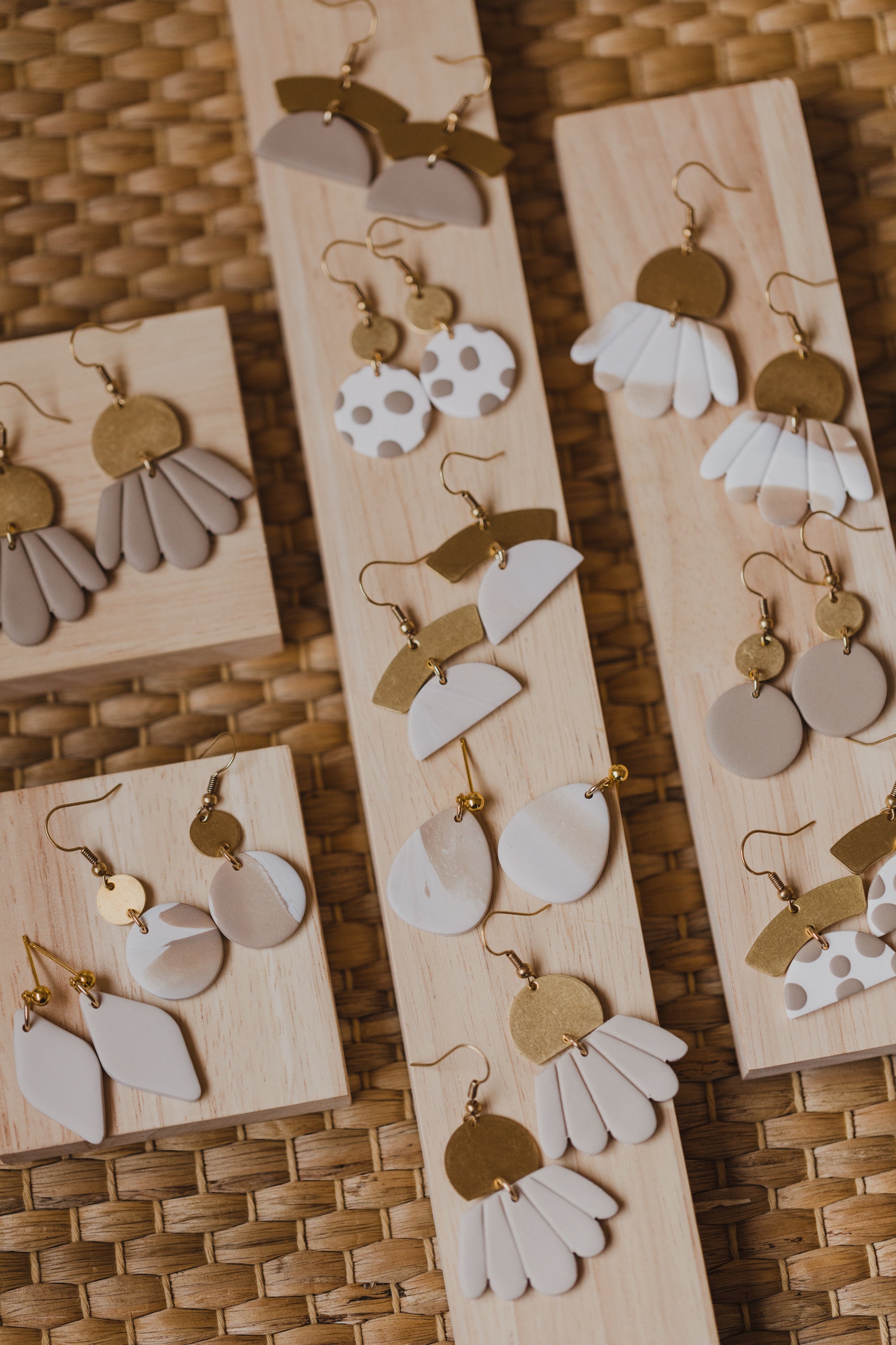 golden earrings with acrylic in white, petrol and brown