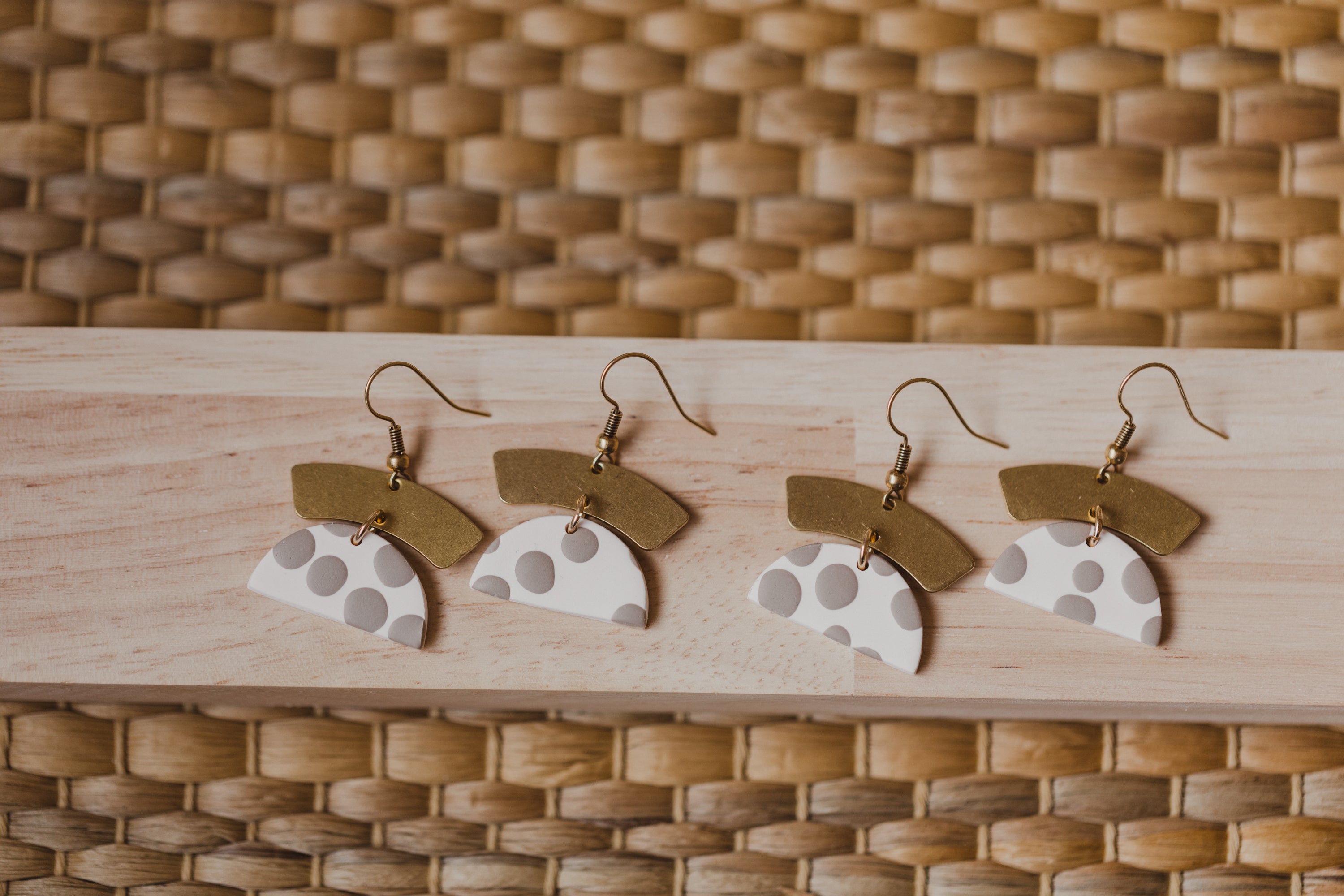 golden earrings with acrylic in white, petrol and brown