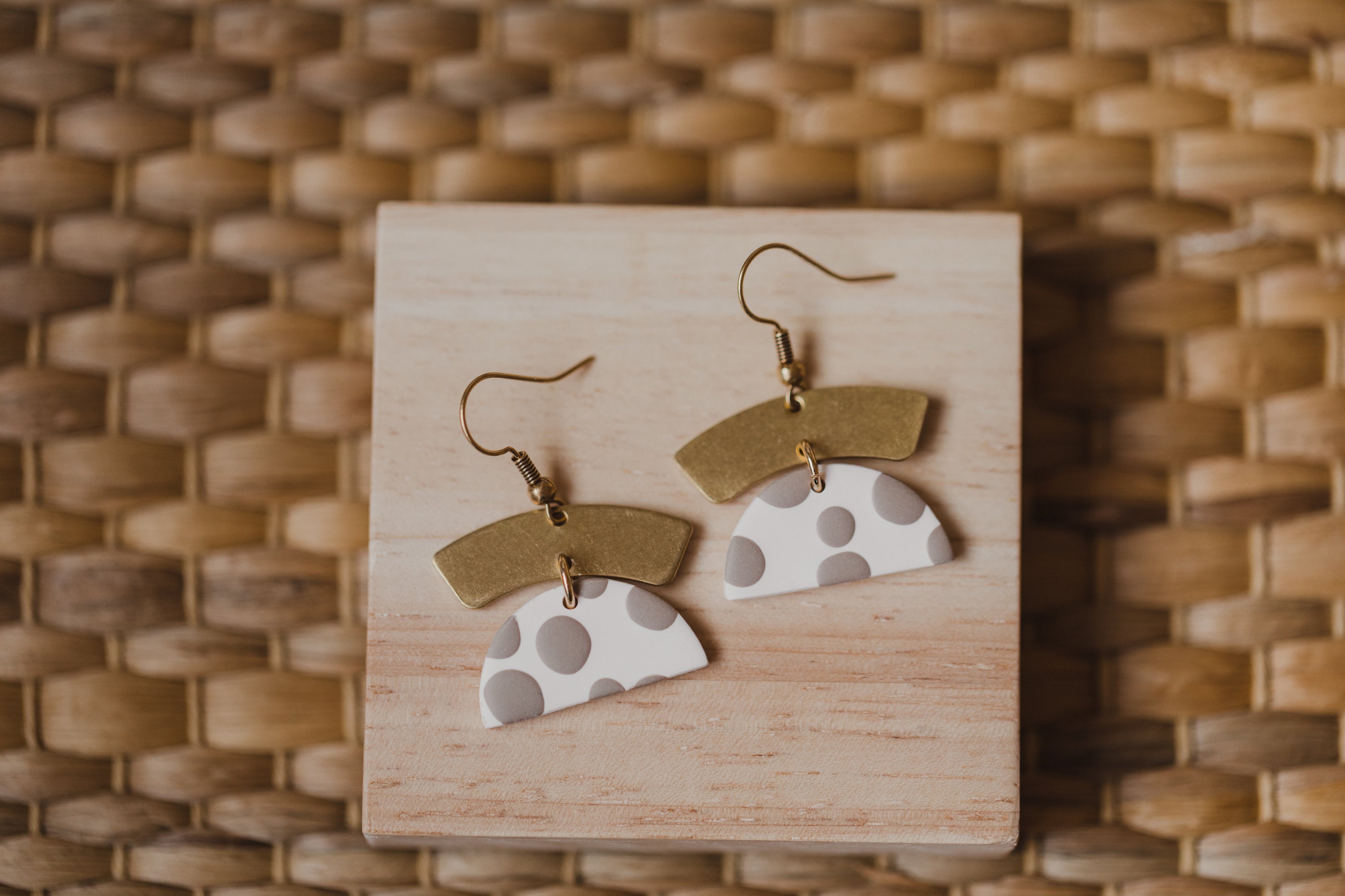 golden earrings with acrylic in white, petrol and brown