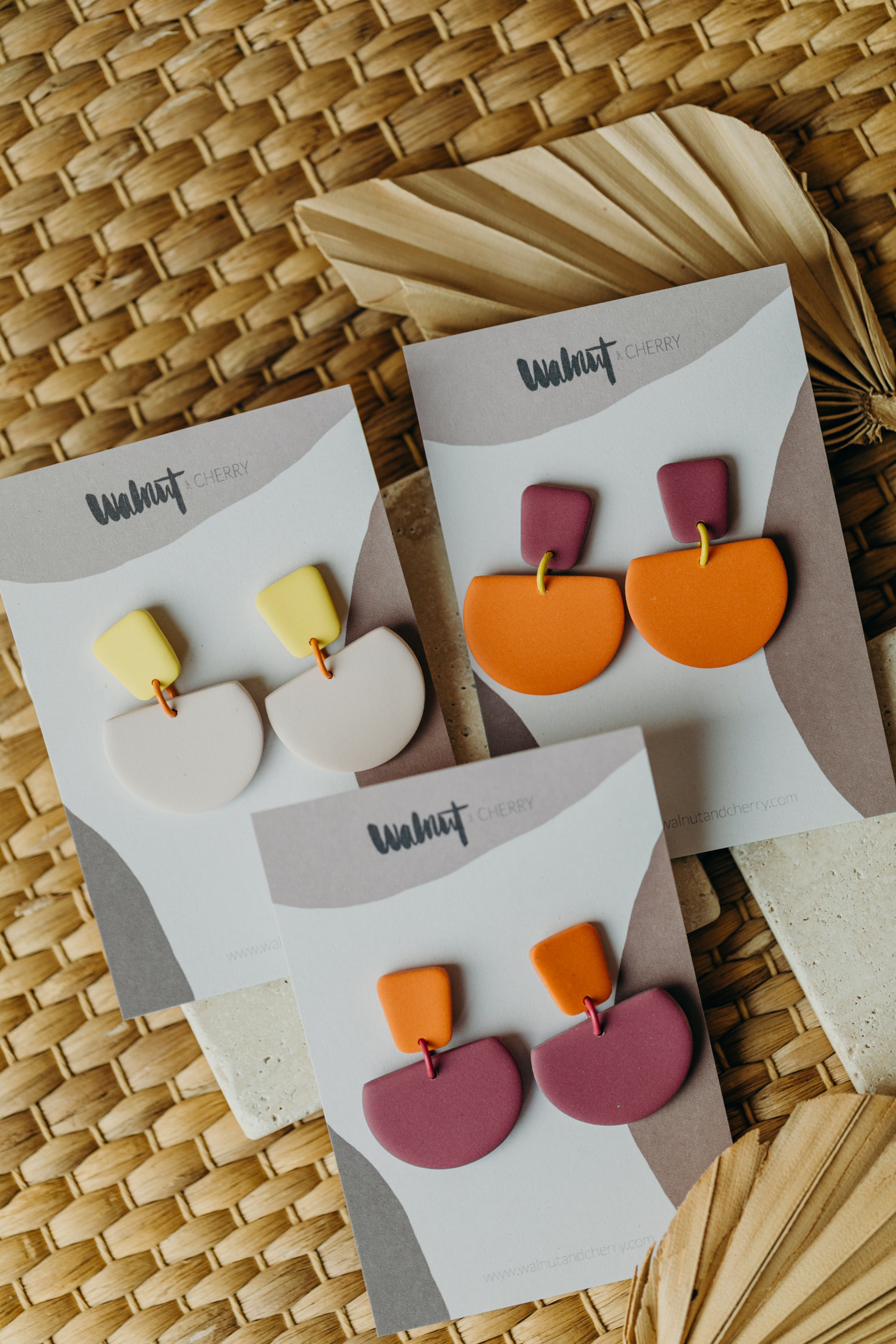 Hoop earrings with round polymer clay pendant and leaf