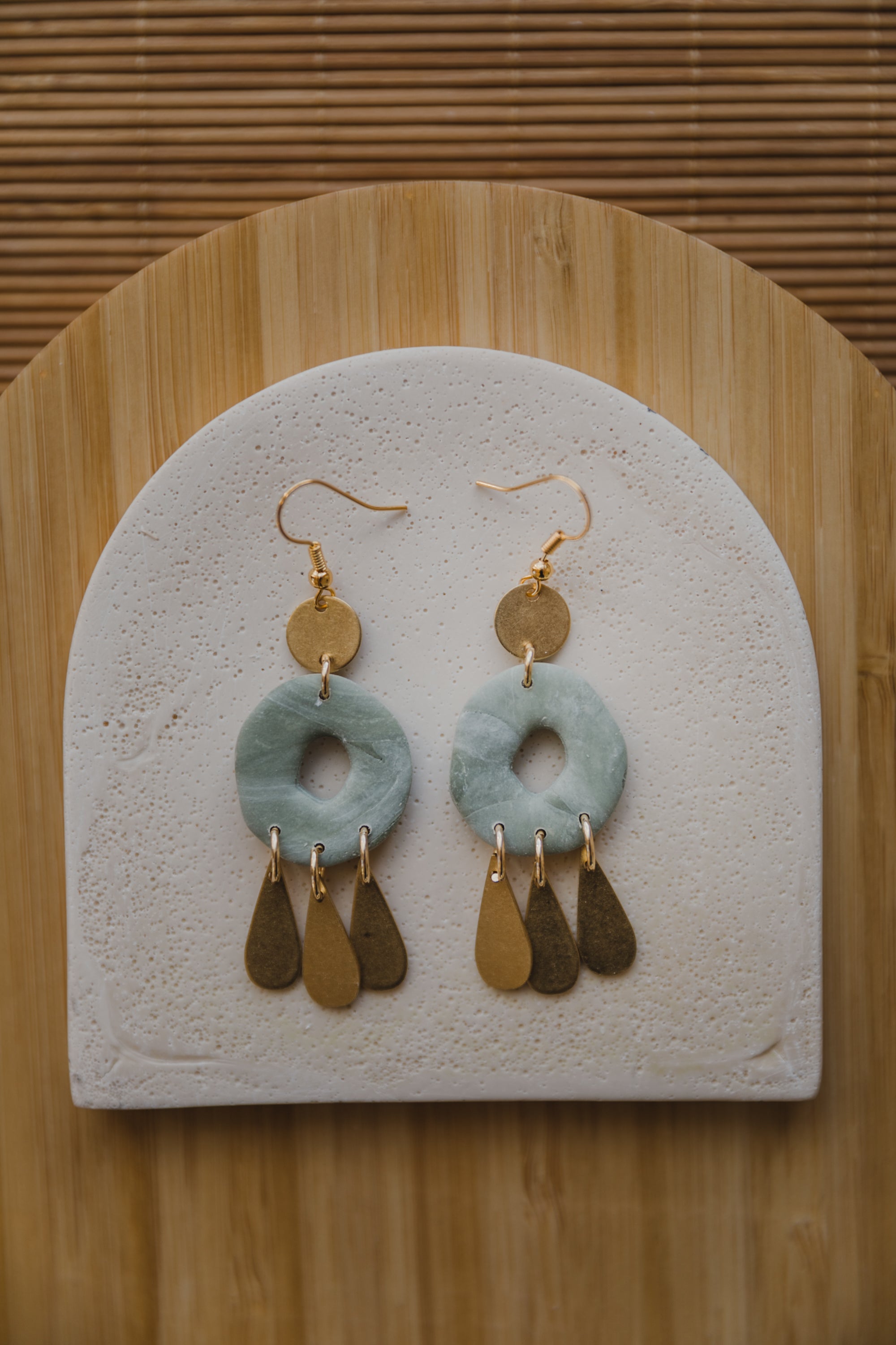 Hoop earrings with round polymer clay pendant and leaf