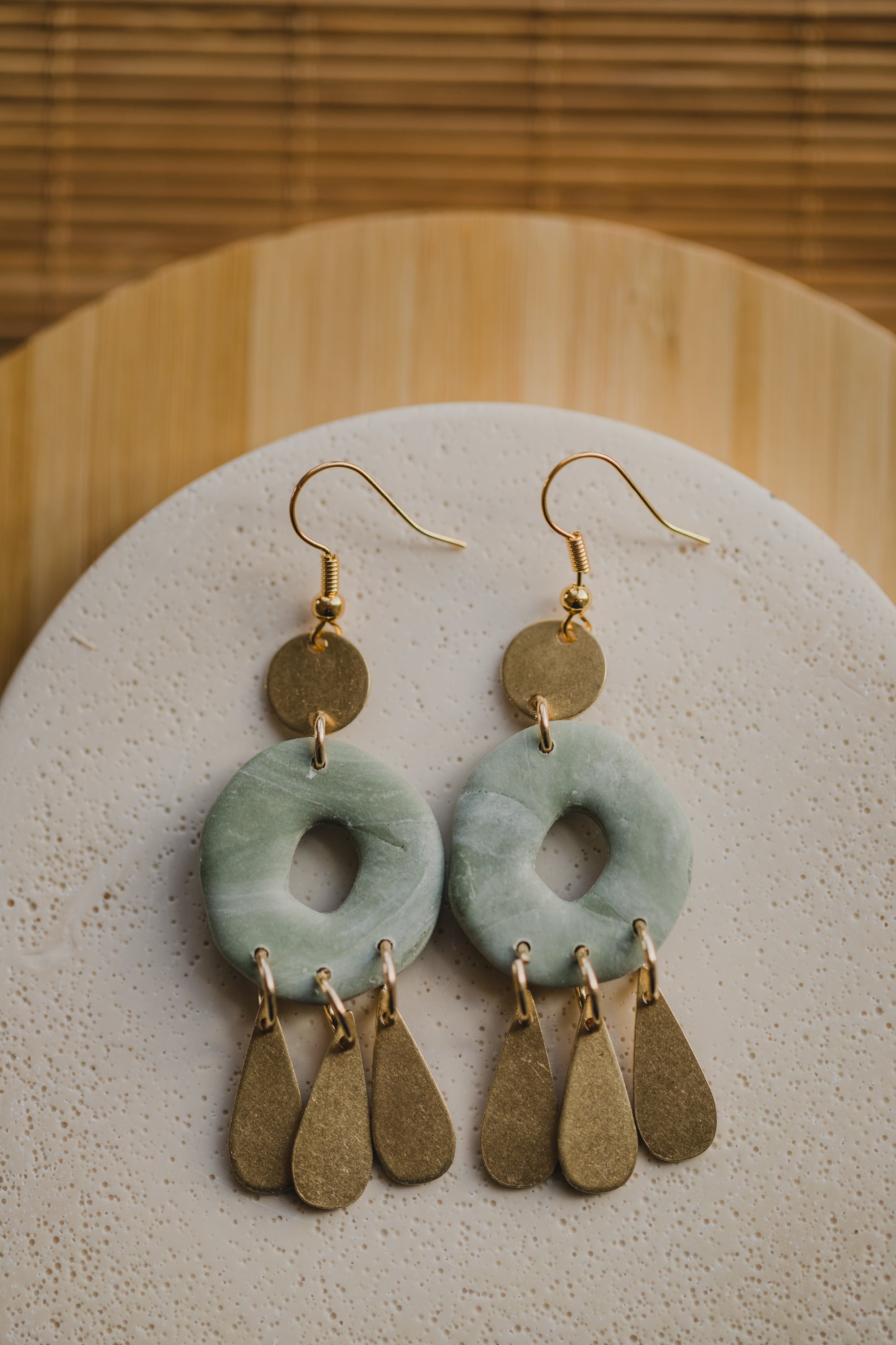 Hoop earrings with round polymer clay pendant and leaf