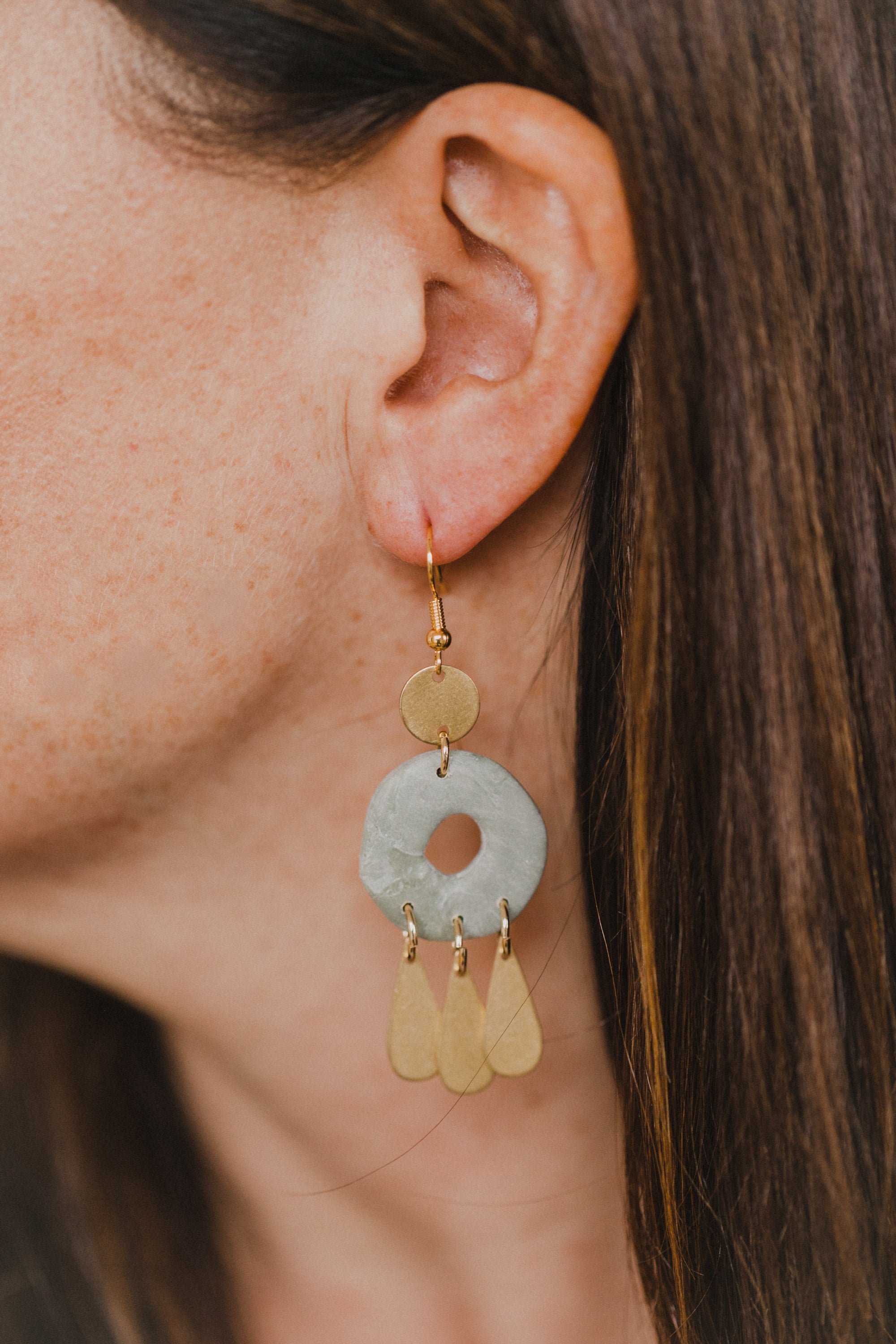 Hoop earrings with round polymer clay pendant and leaf
