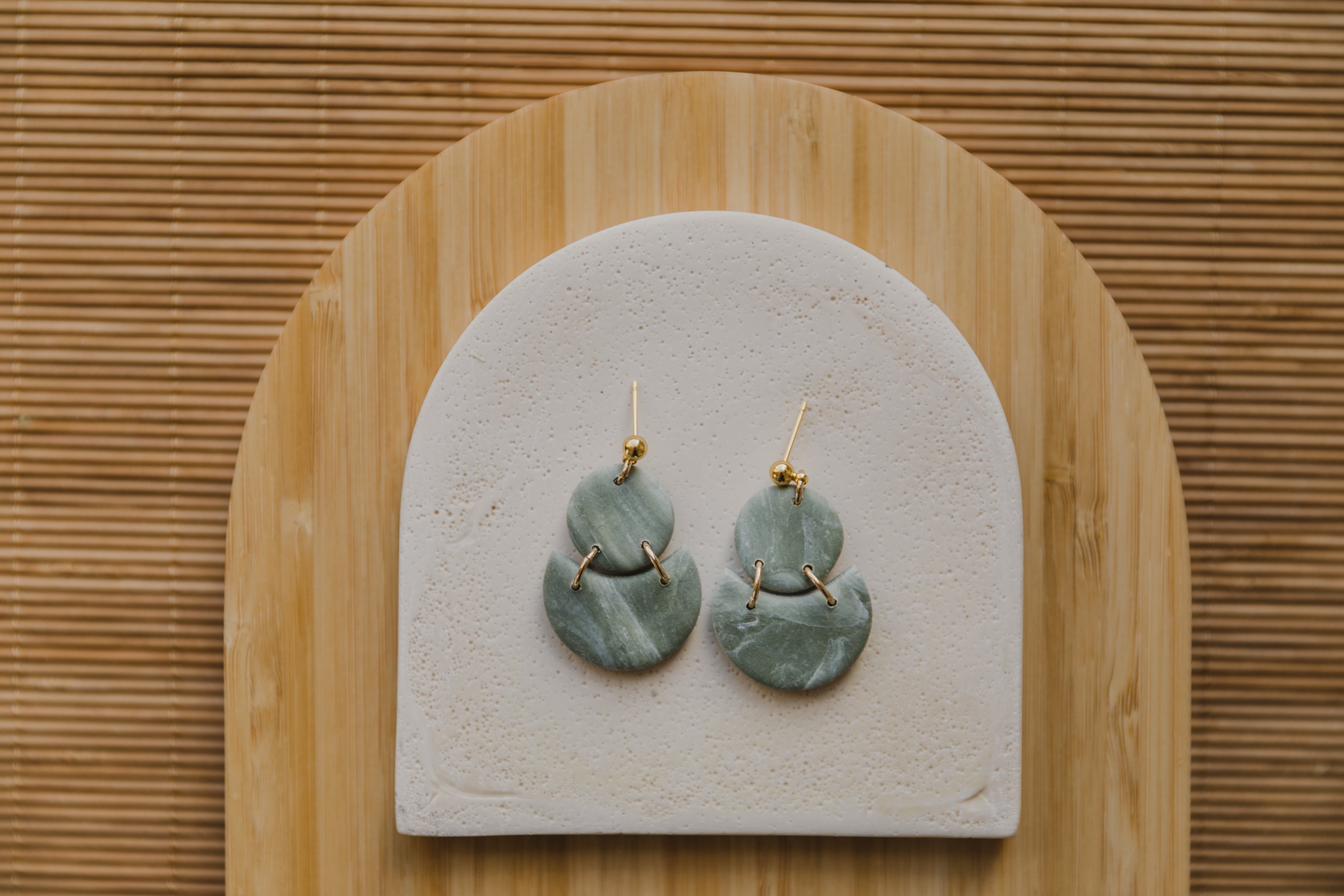 Hoop earrings with round polymer clay pendant and leaf