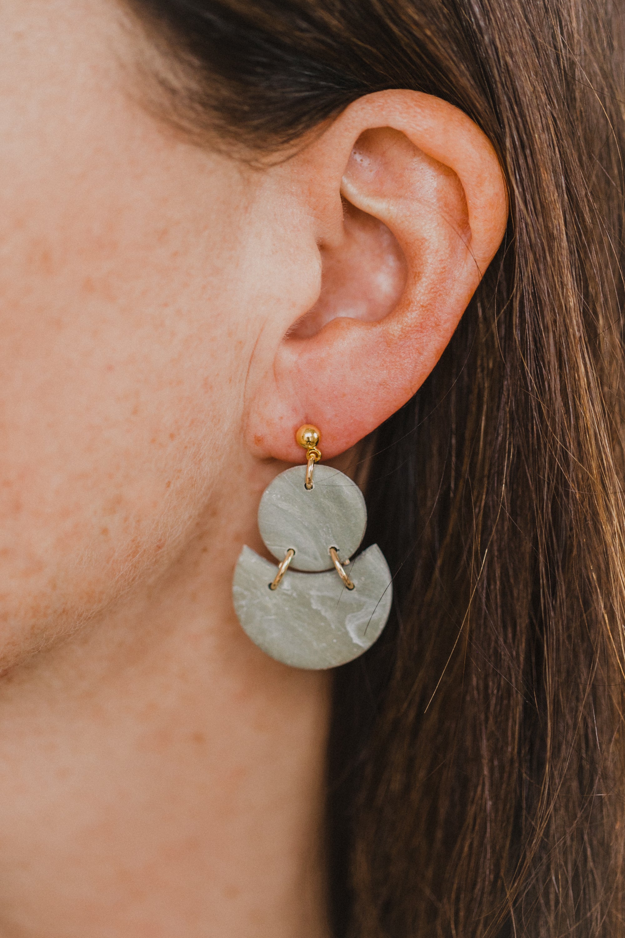 Hoop earrings with round polymer clay pendant and leaf