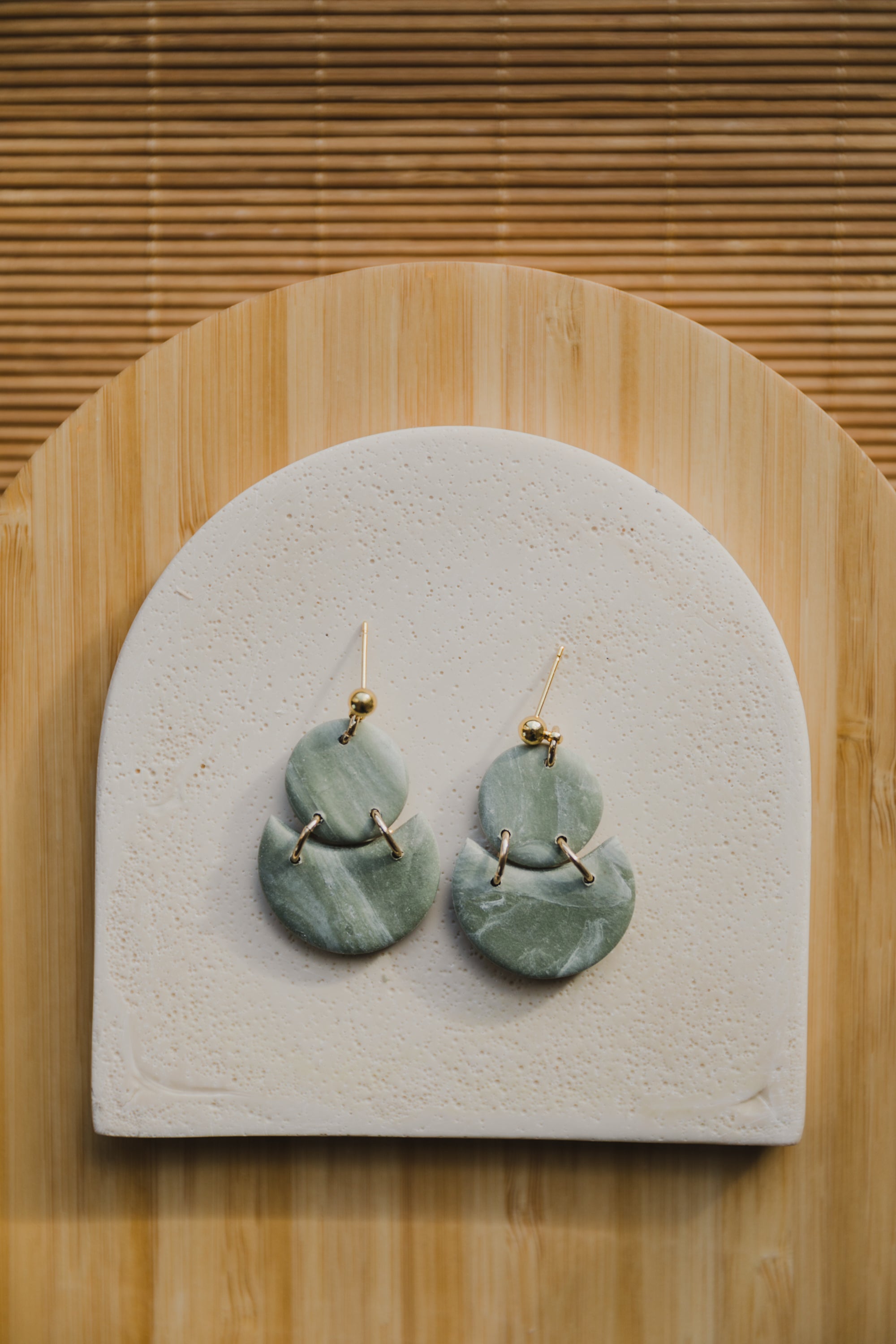Hoop earrings with round polymer clay pendant and leaf