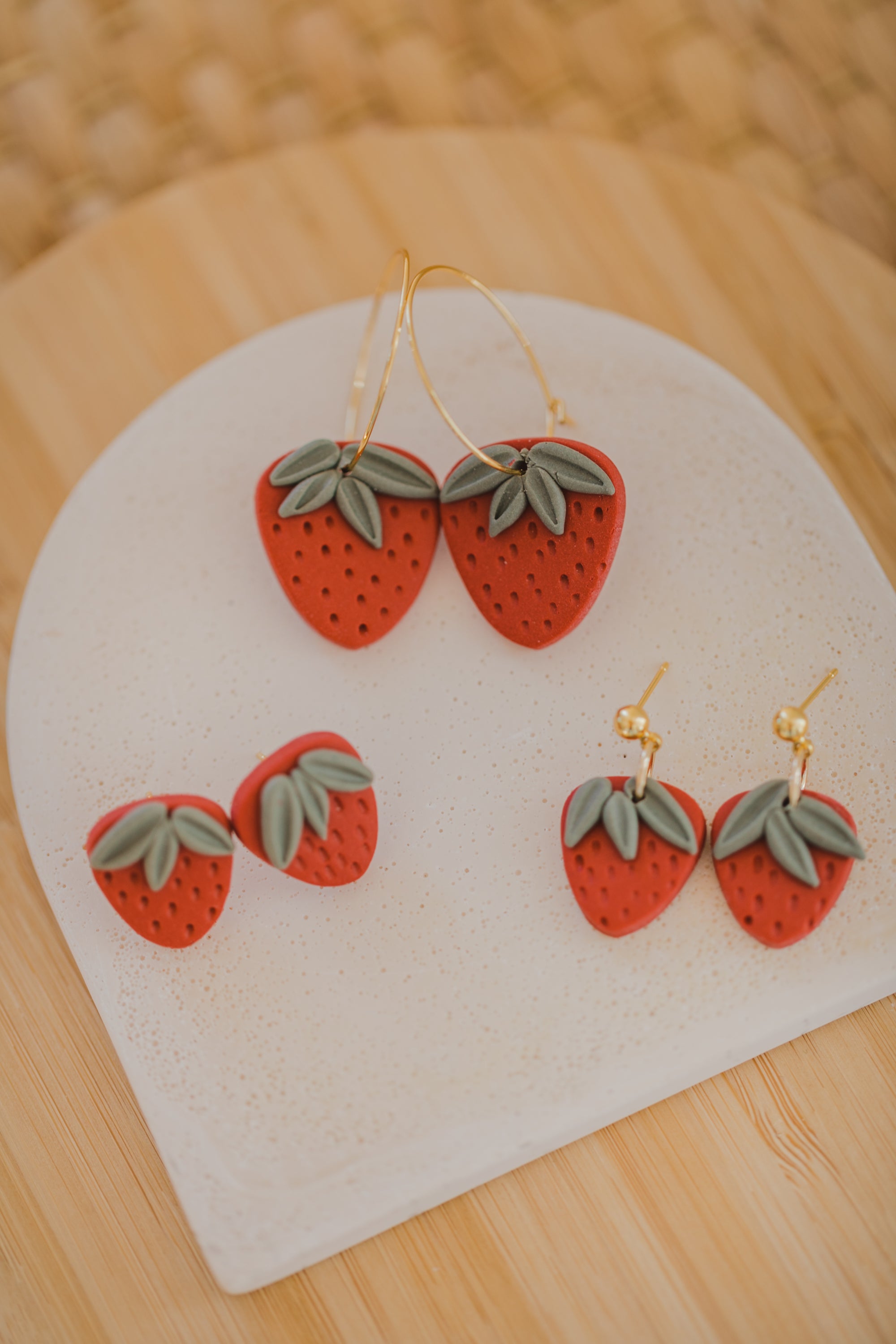 Hoop earrings with round polymer clay pendant and leaf