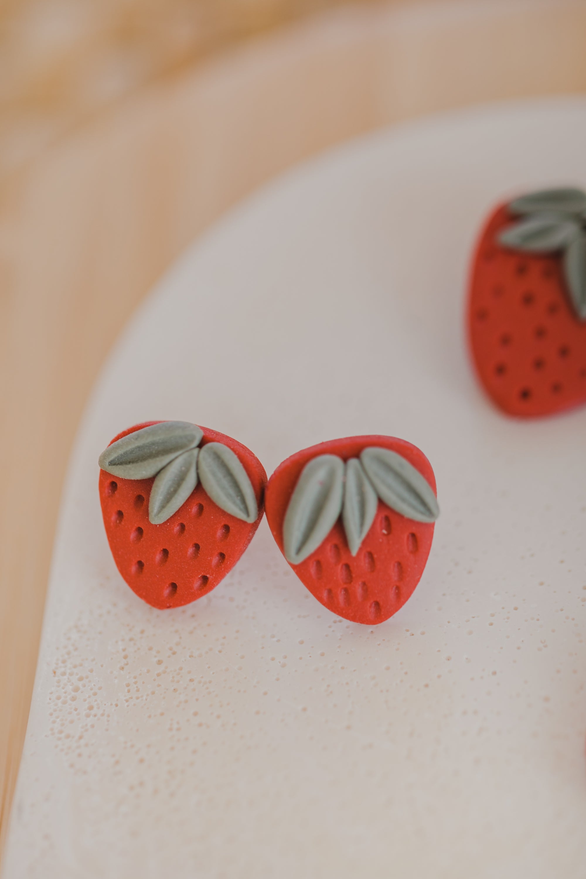 Hoop earrings with round polymer clay pendant and leaf
