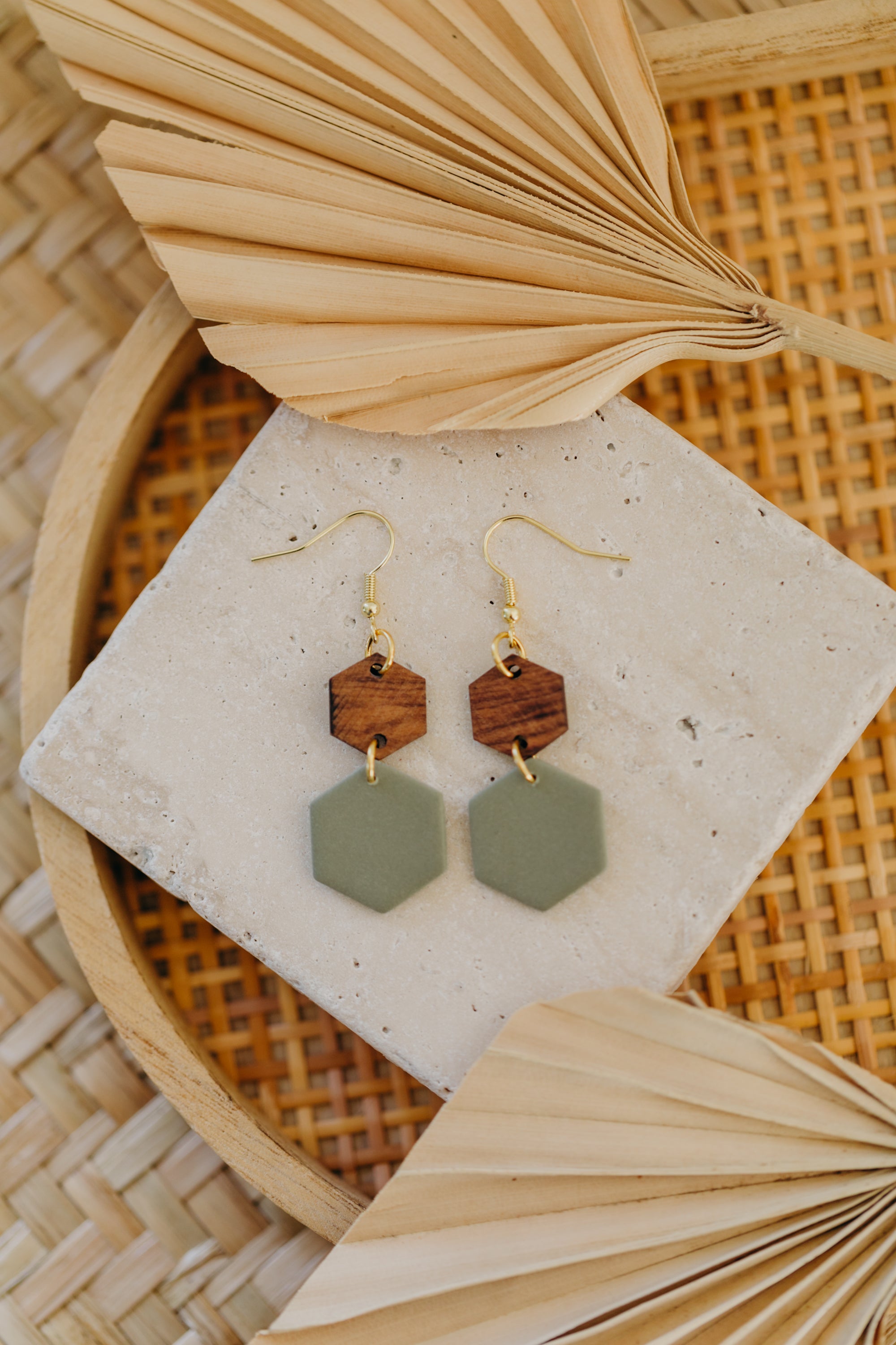 triangular polymer clay earrings in eucalyptus green with rectangular wooden pendant