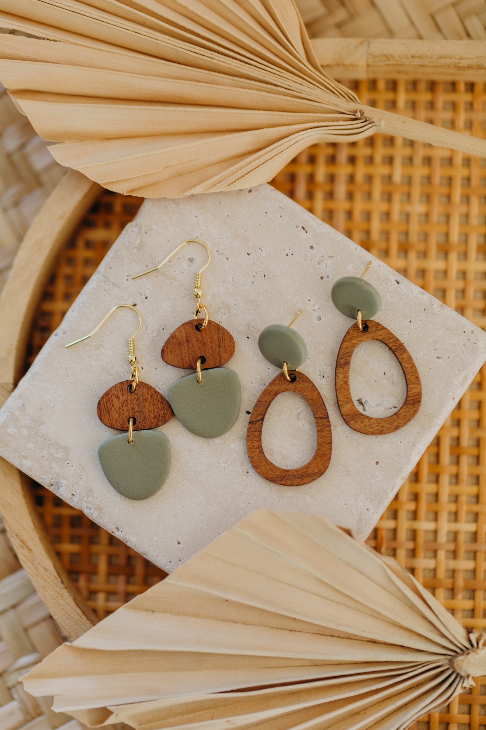 triangular polymer clay earrings in eucalyptus green with rectangular wooden pendant
