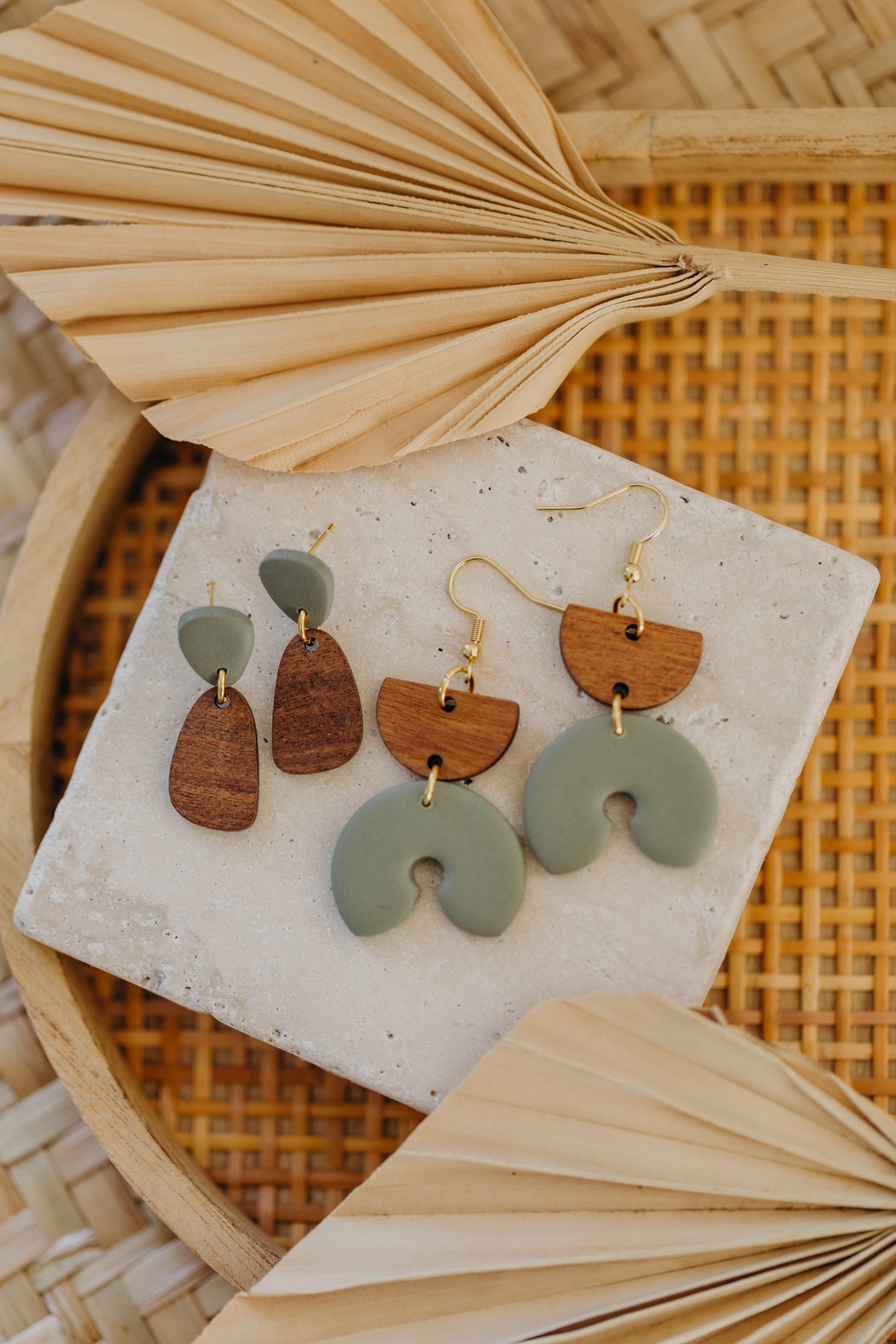 triangular polymer clay earrings in eucalyptus green with rectangular wooden pendant