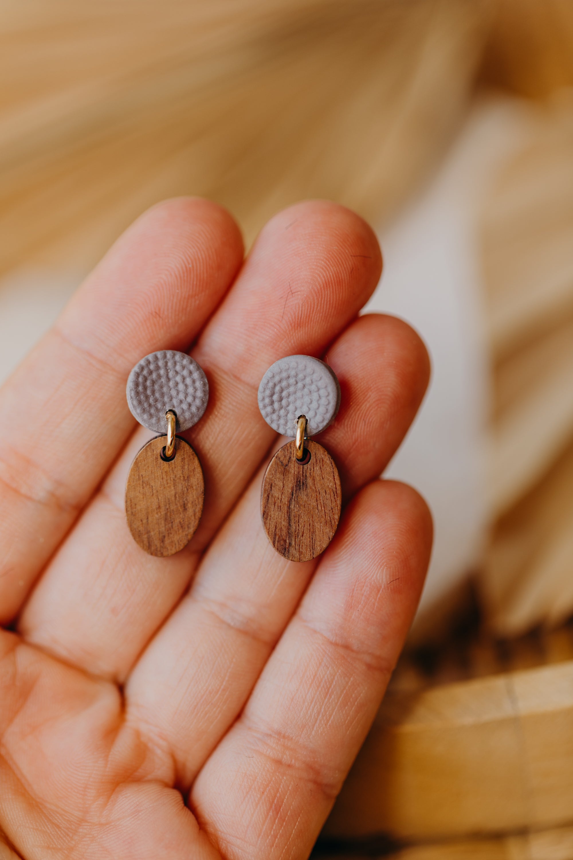 round polymer clay earrings in mauve with oval wooden pendant