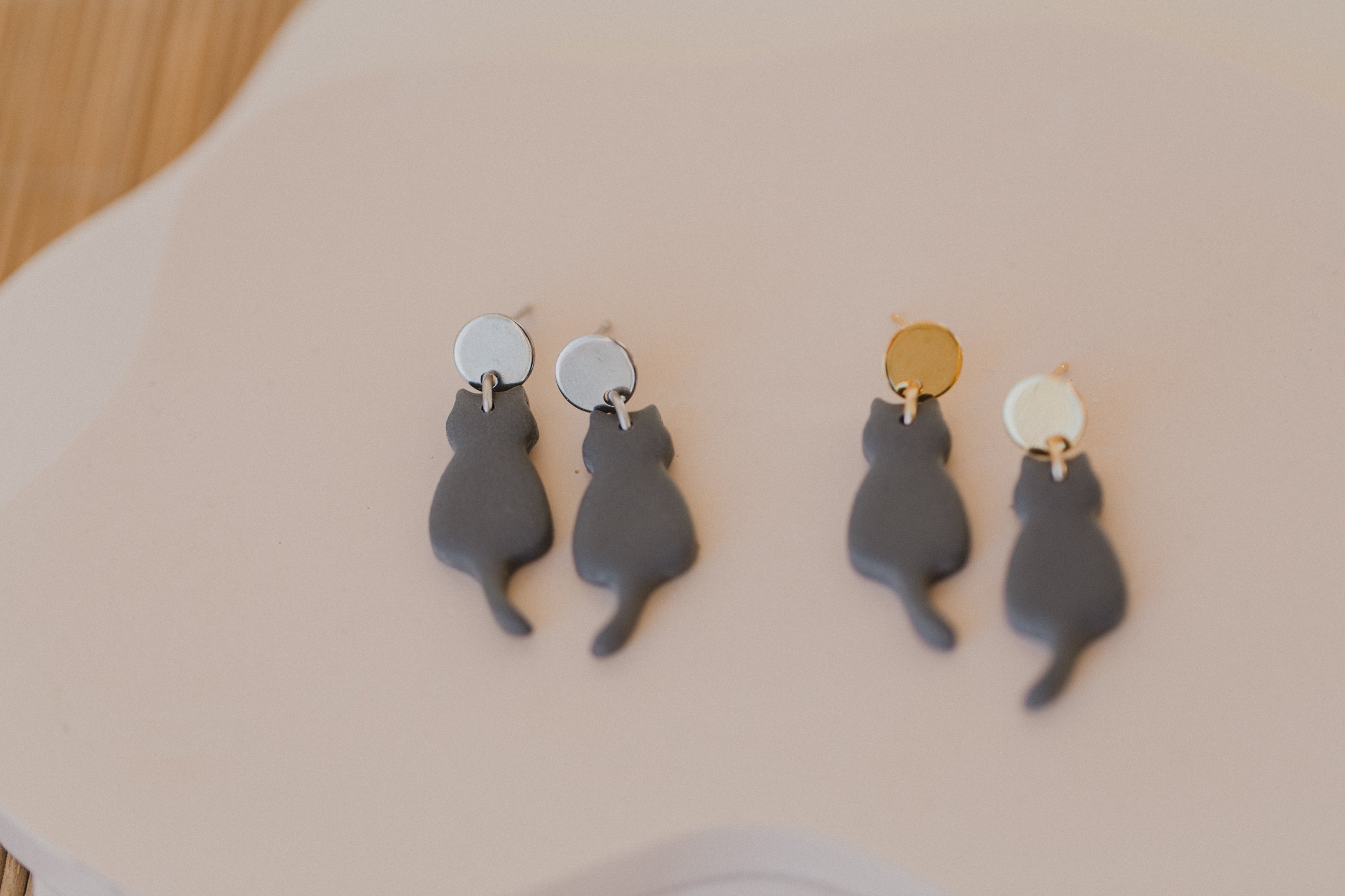 golden earrings with acrylic in white, petrol and brown