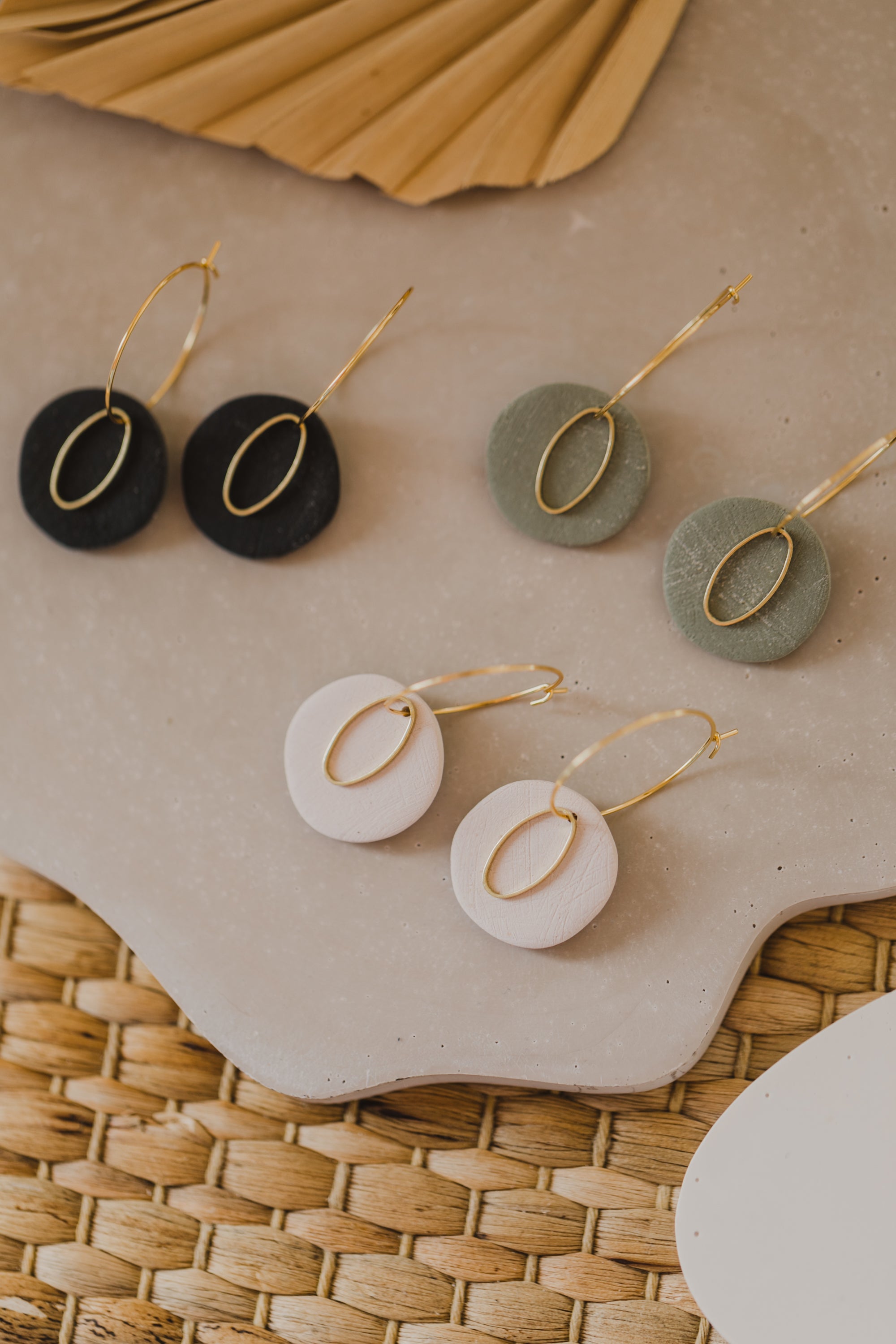 Hoop earrings with round polymer clay pendant and leaf