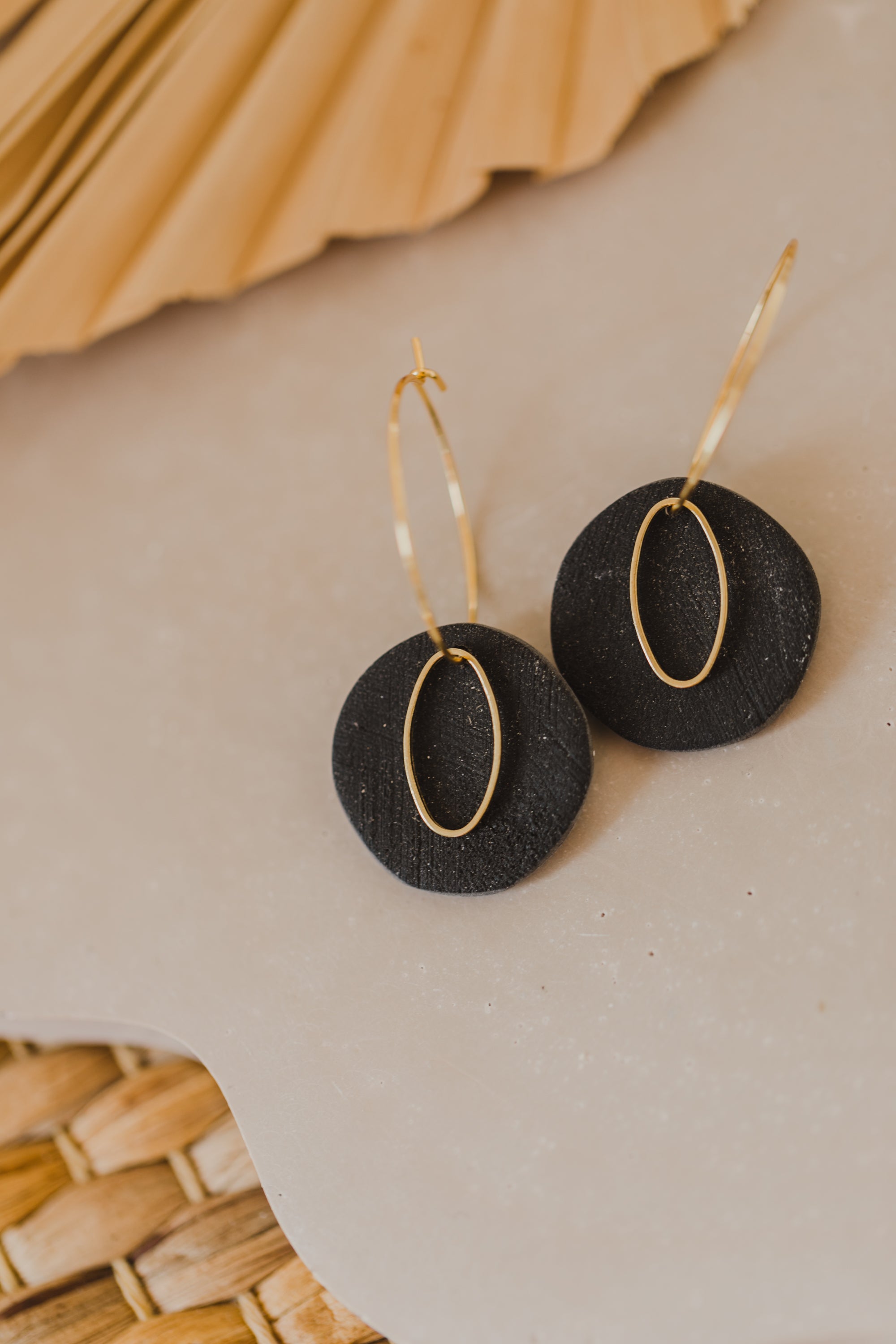 Hoop earrings with round polymer clay pendant and leaf
