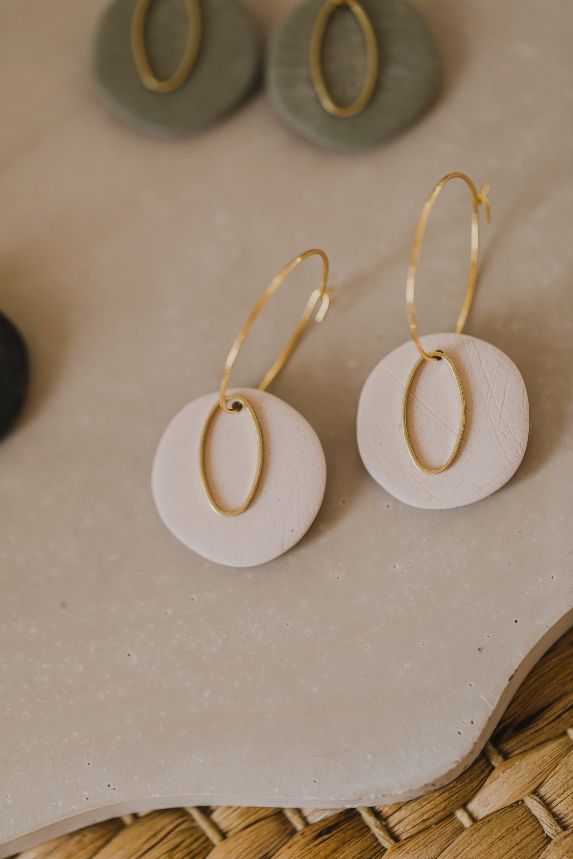 Hoop earrings with round polymer clay pendant and leaf