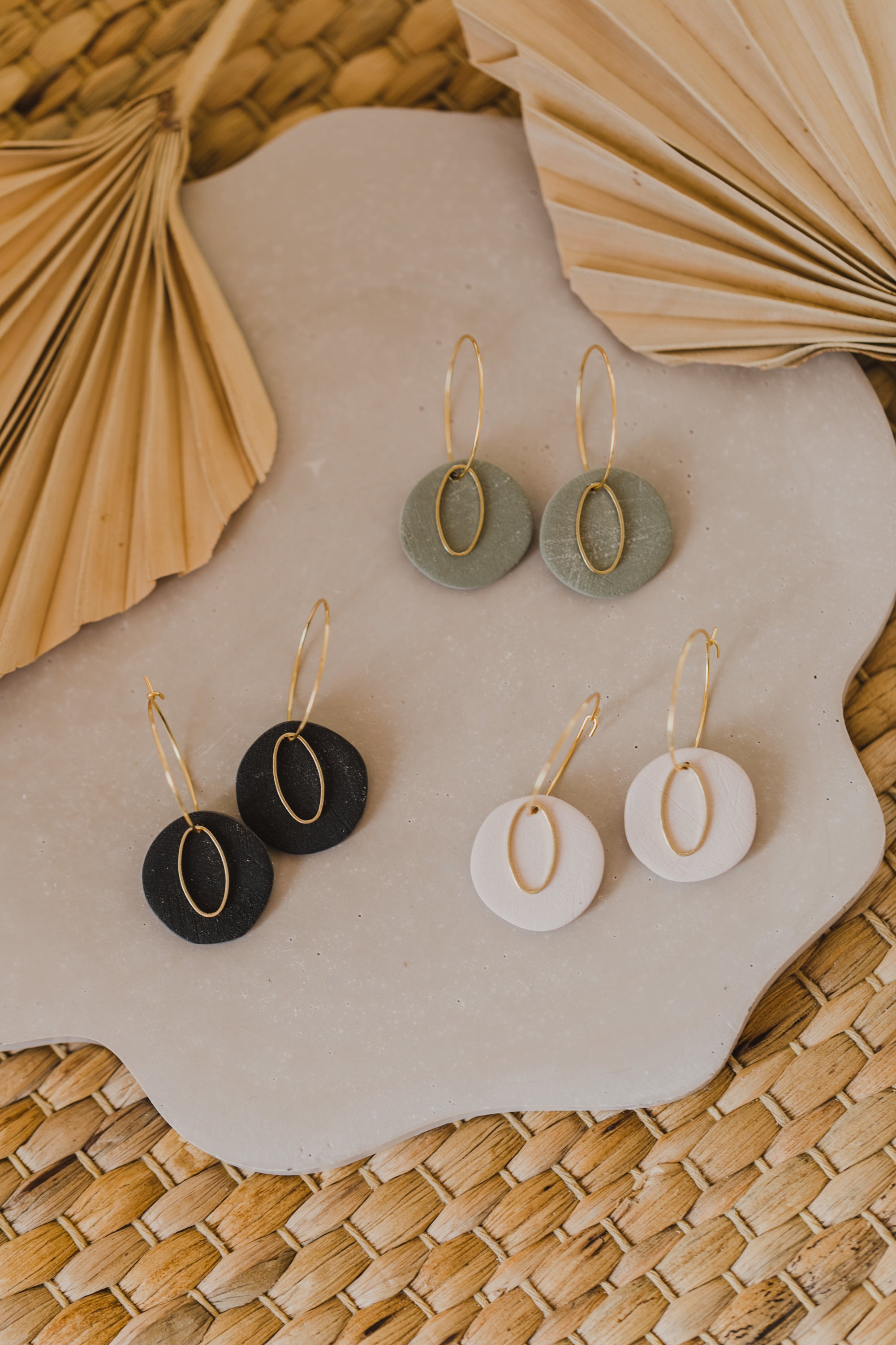 Hoop earrings with round polymer clay pendant and leaf