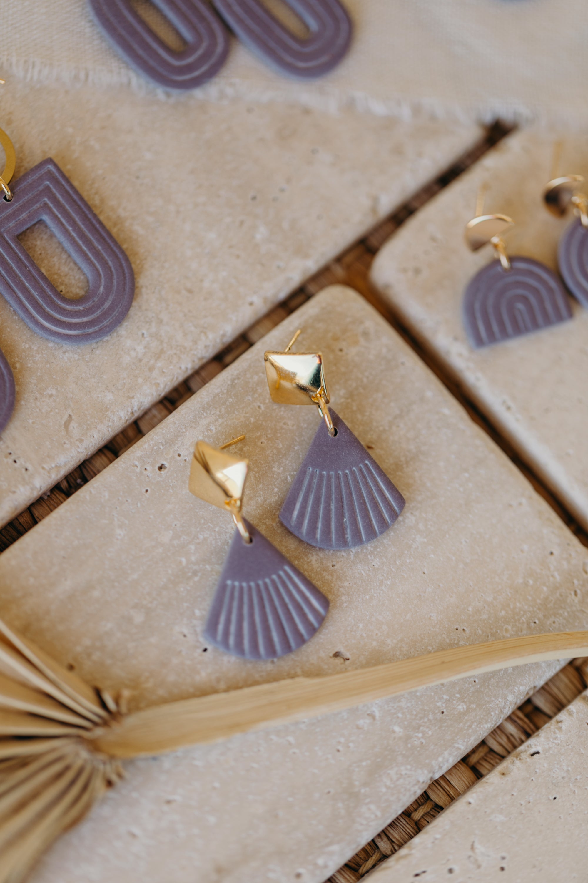 light purple polymer clay earrings with white lines