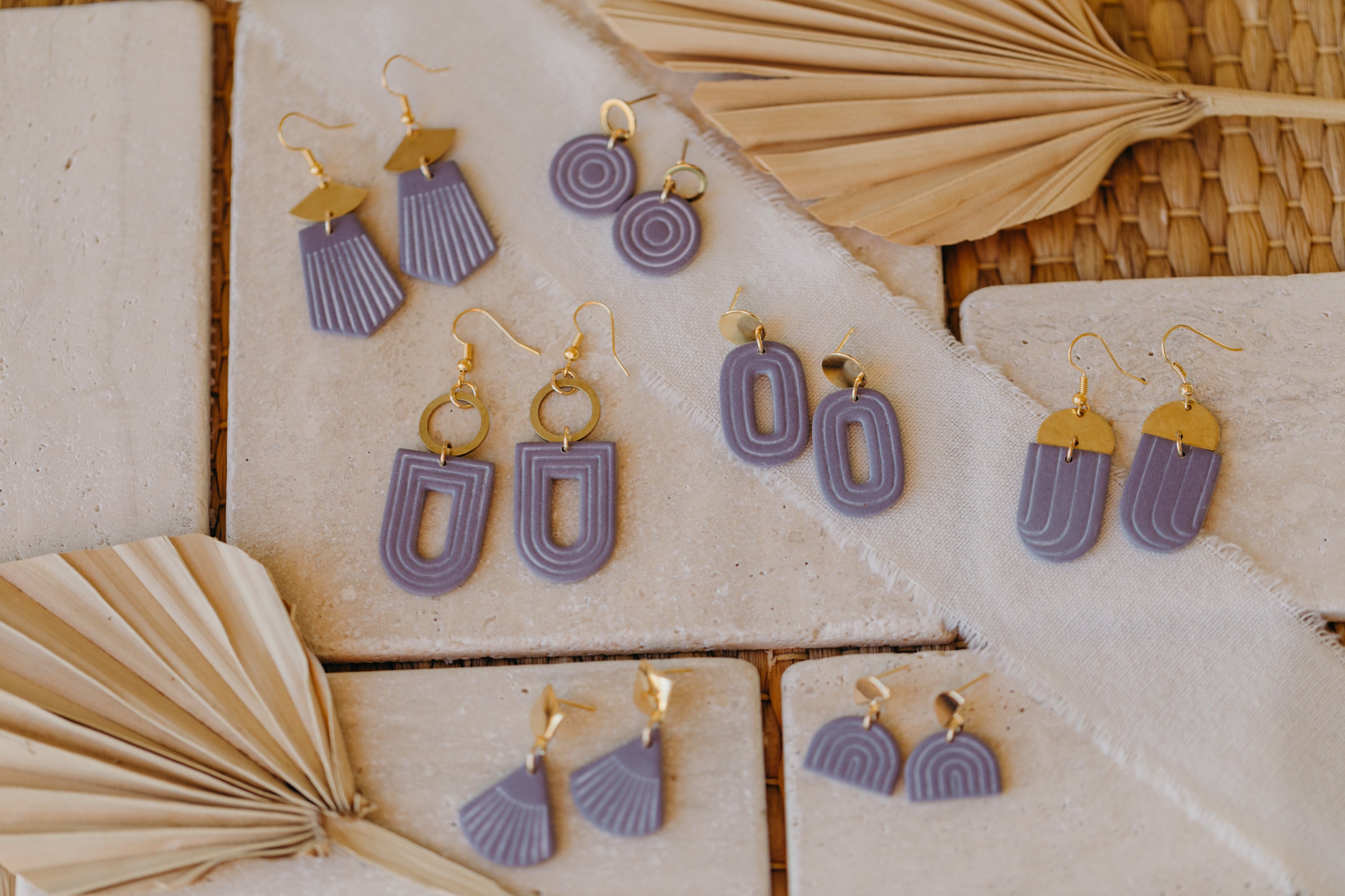 light purple polymer clay earrings with white lines
