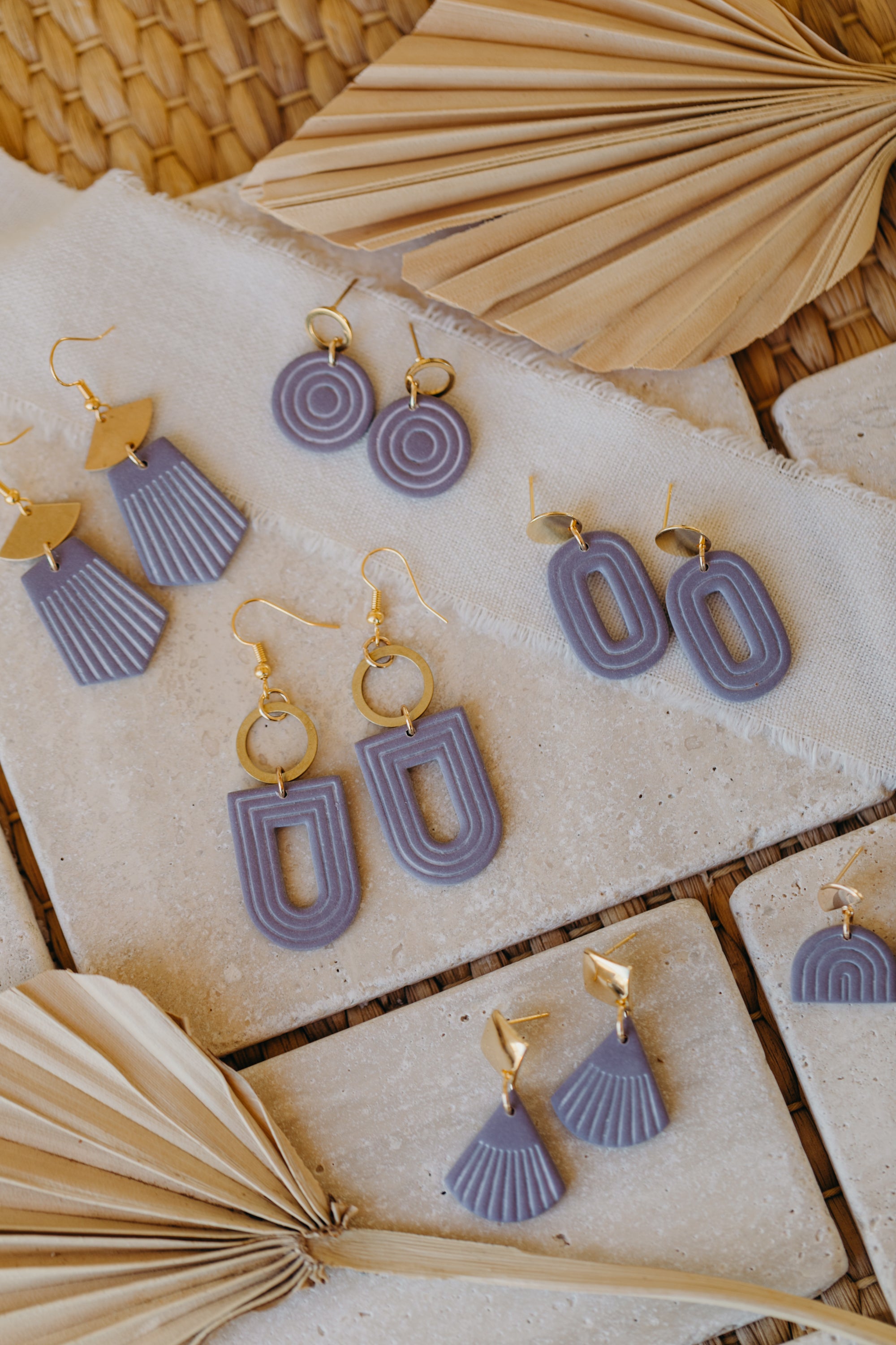 light purple polymer clay earrings with white lines