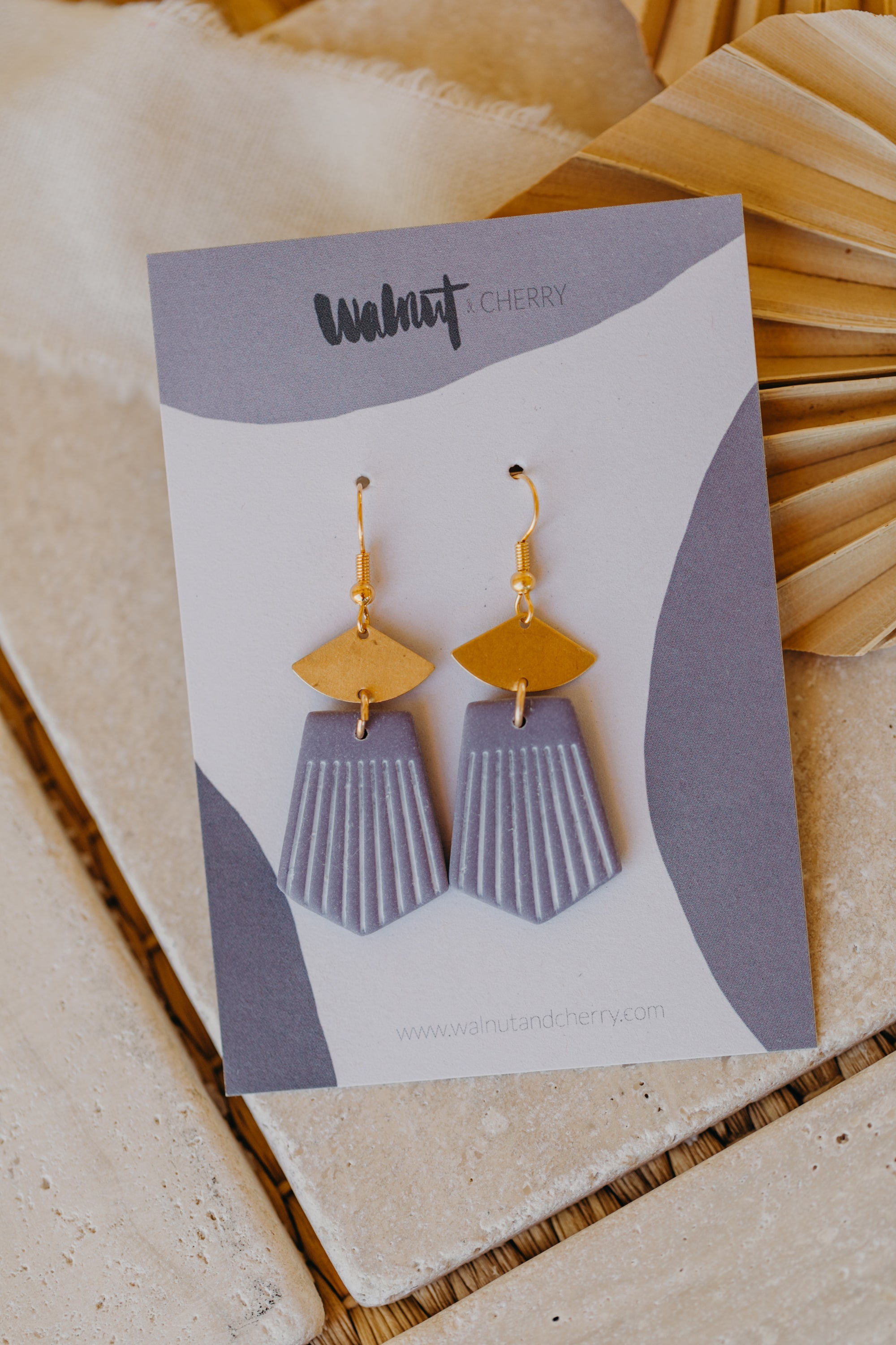 light purple polymer clay earrings with white lines