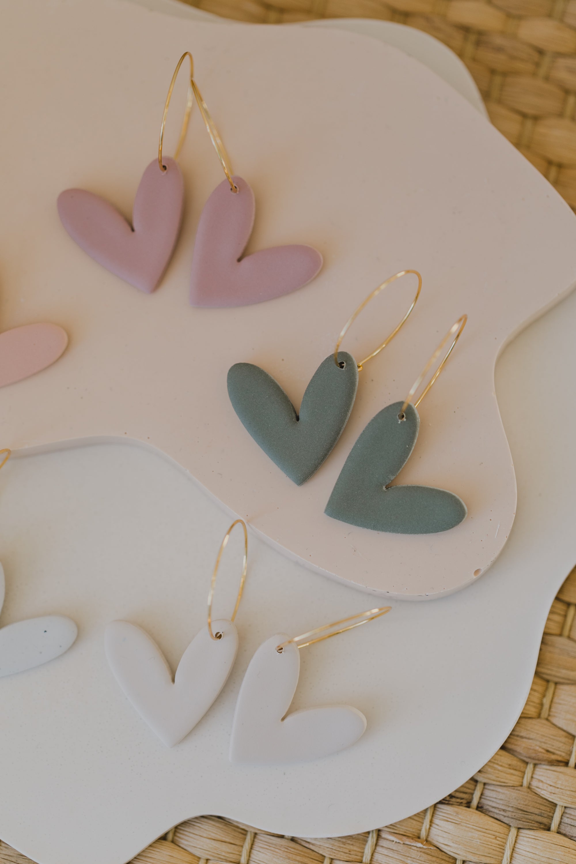 Hoop earrings with round polymer clay pendant and leaf