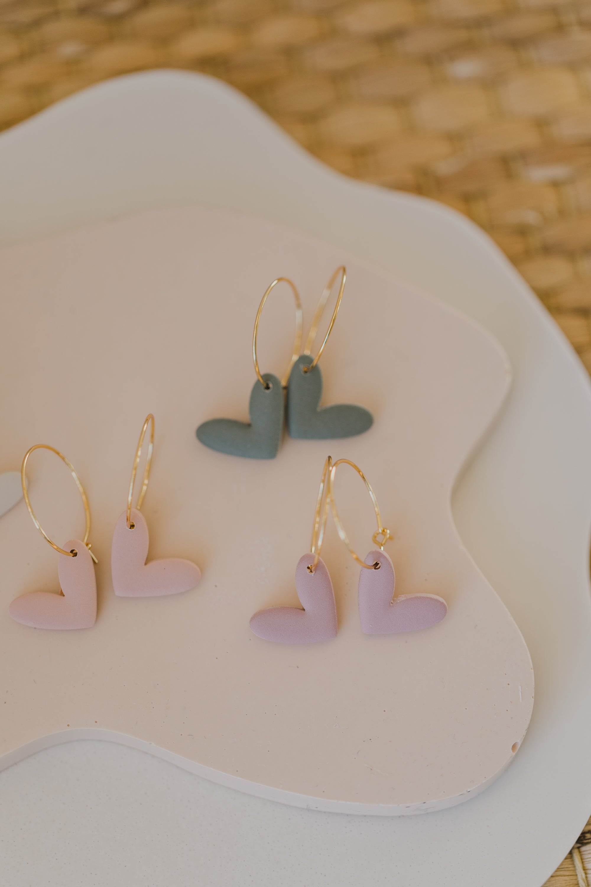 Hoop earrings with round polymer clay pendant and leaf