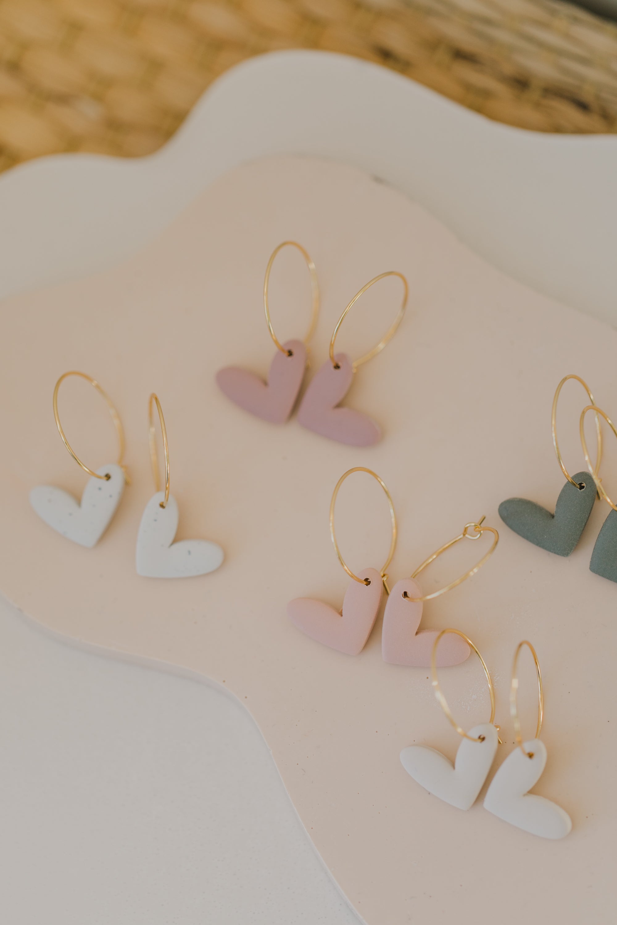 Hoop earrings with round polymer clay pendant and leaf