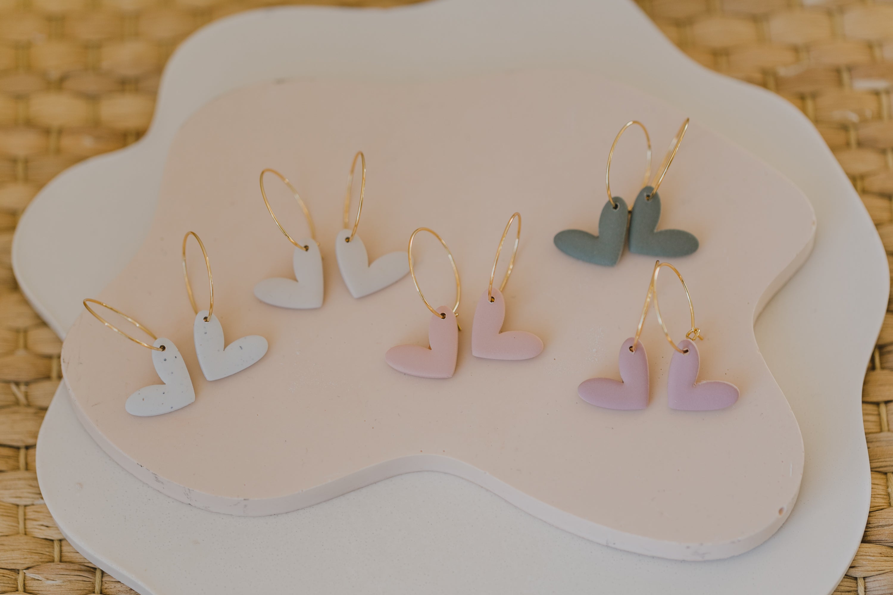 Hoop earrings with round polymer clay pendant and leaf