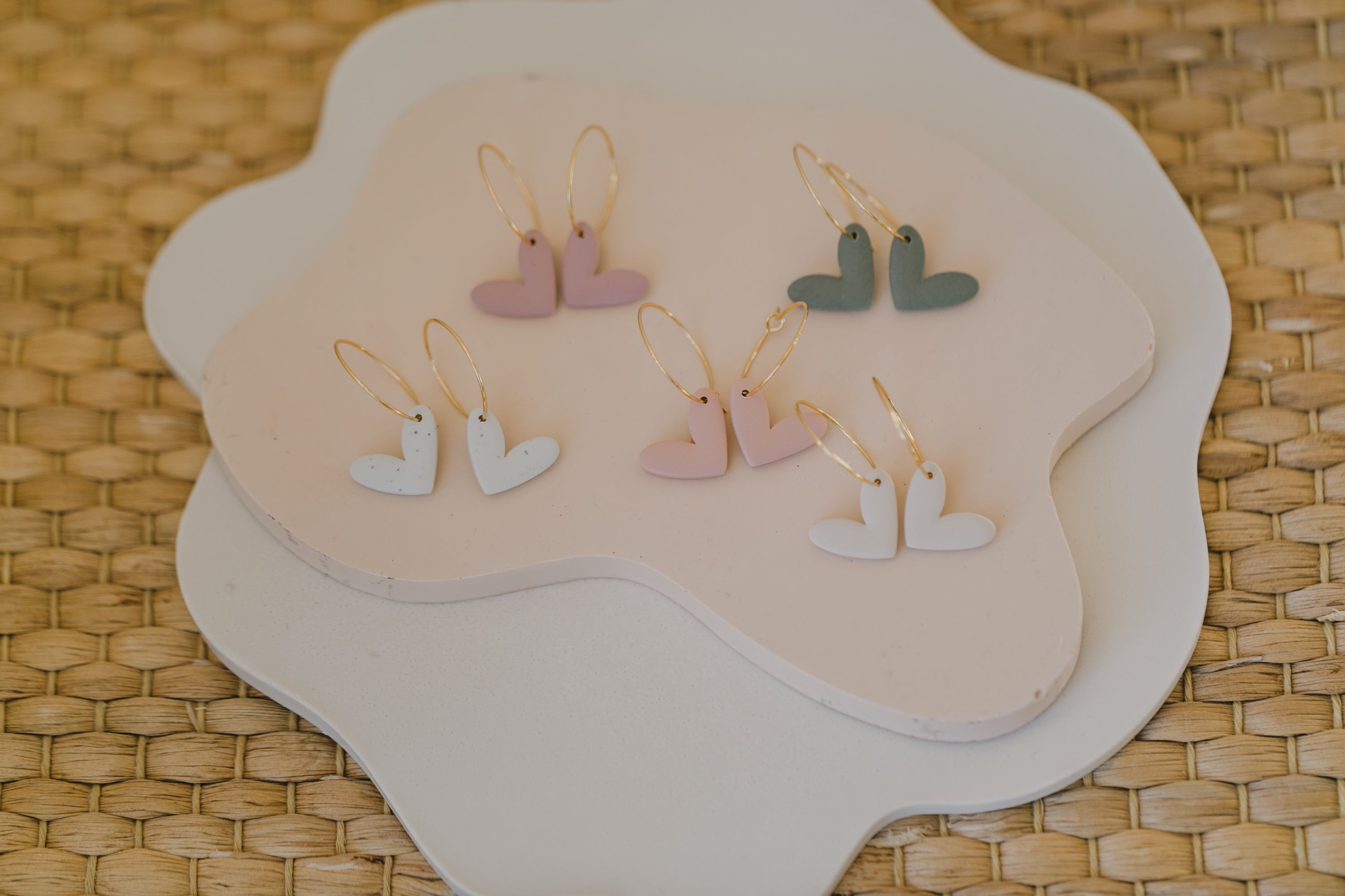 Hoop earrings with round polymer clay pendant and leaf