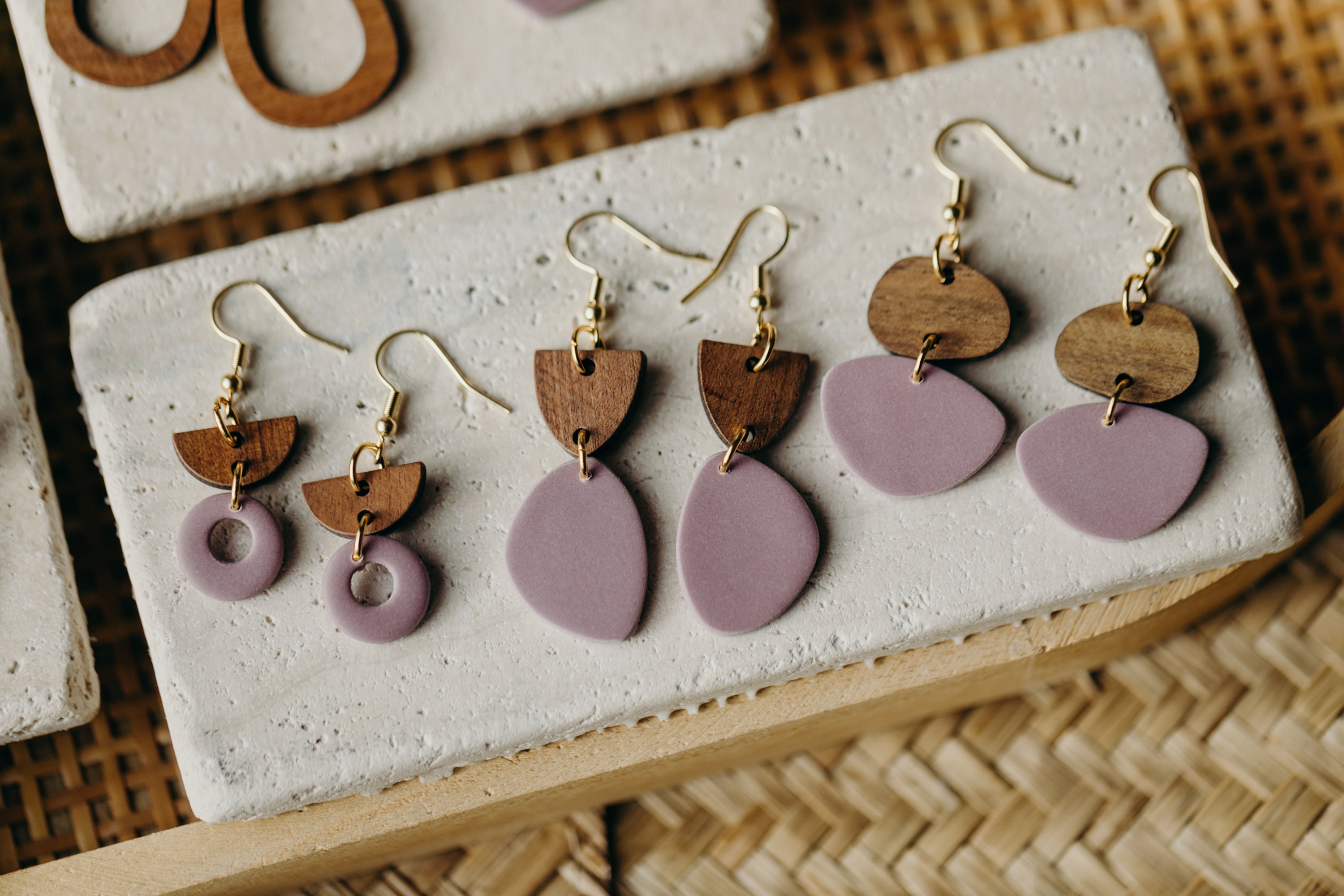 triangular polymer clay earrings in eucalyptus green with rectangular wooden pendant