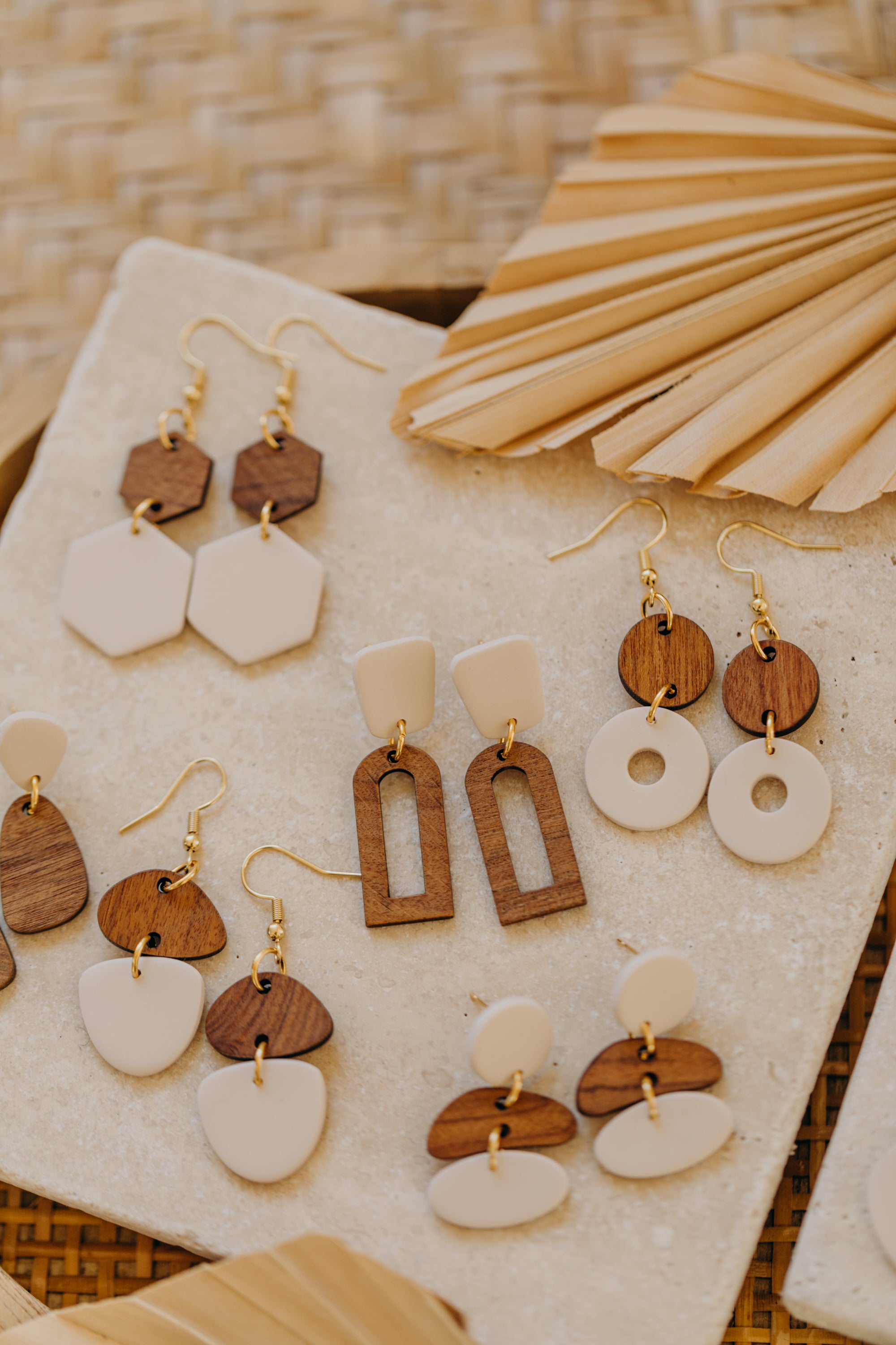 triangular polymer clay earrings in eucalyptus green with rectangular wooden pendant