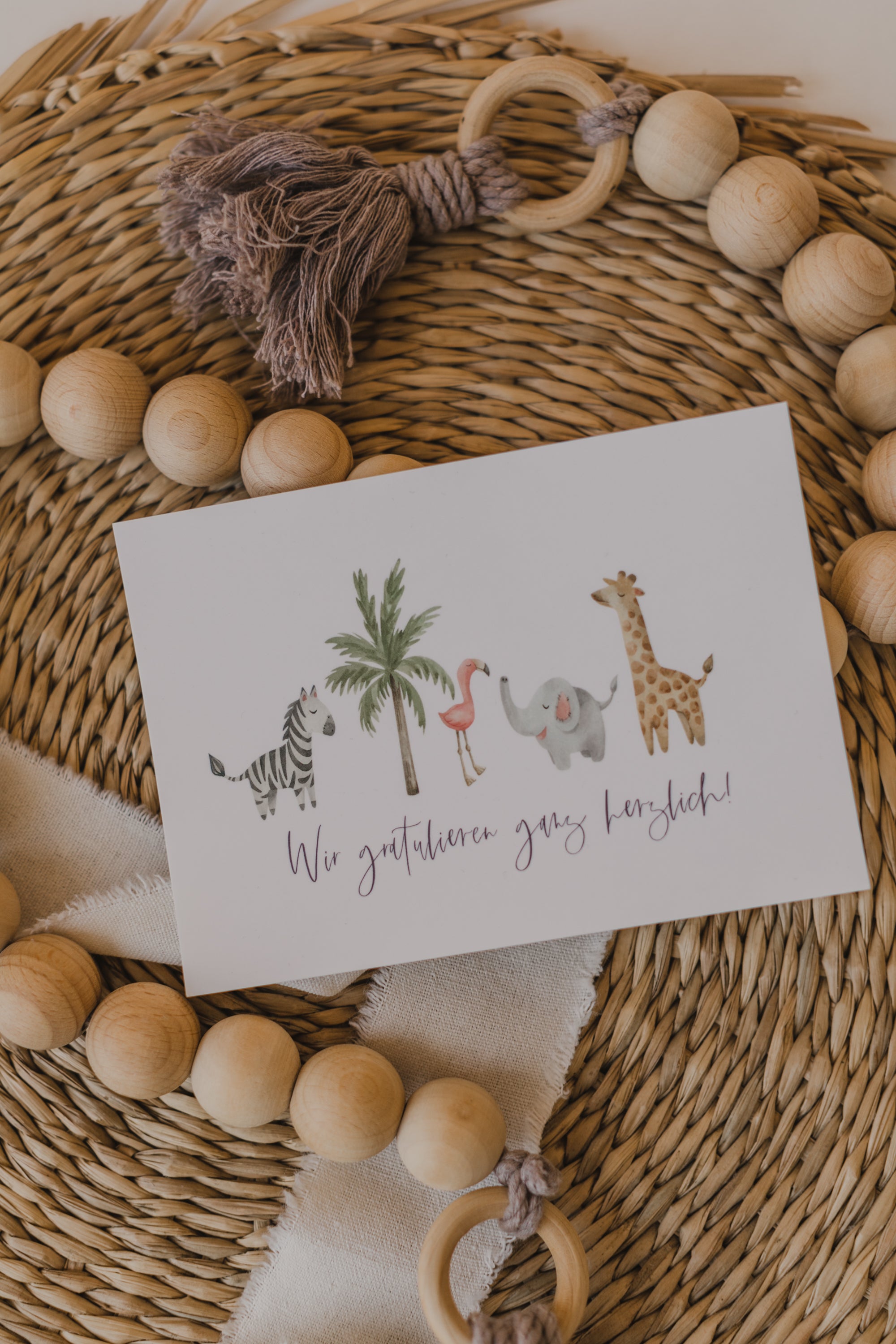 Postkarte afrikanische Tiere mit dem Aufdruck "Wir gratulieren ganz herzlich"