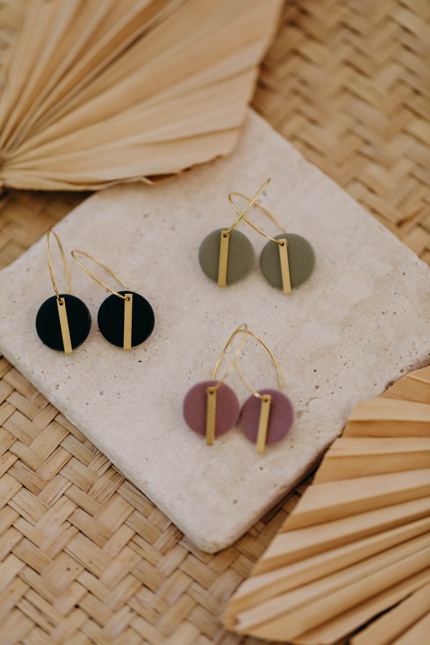 Hoop earrings with round polymer clay pendant and leaf