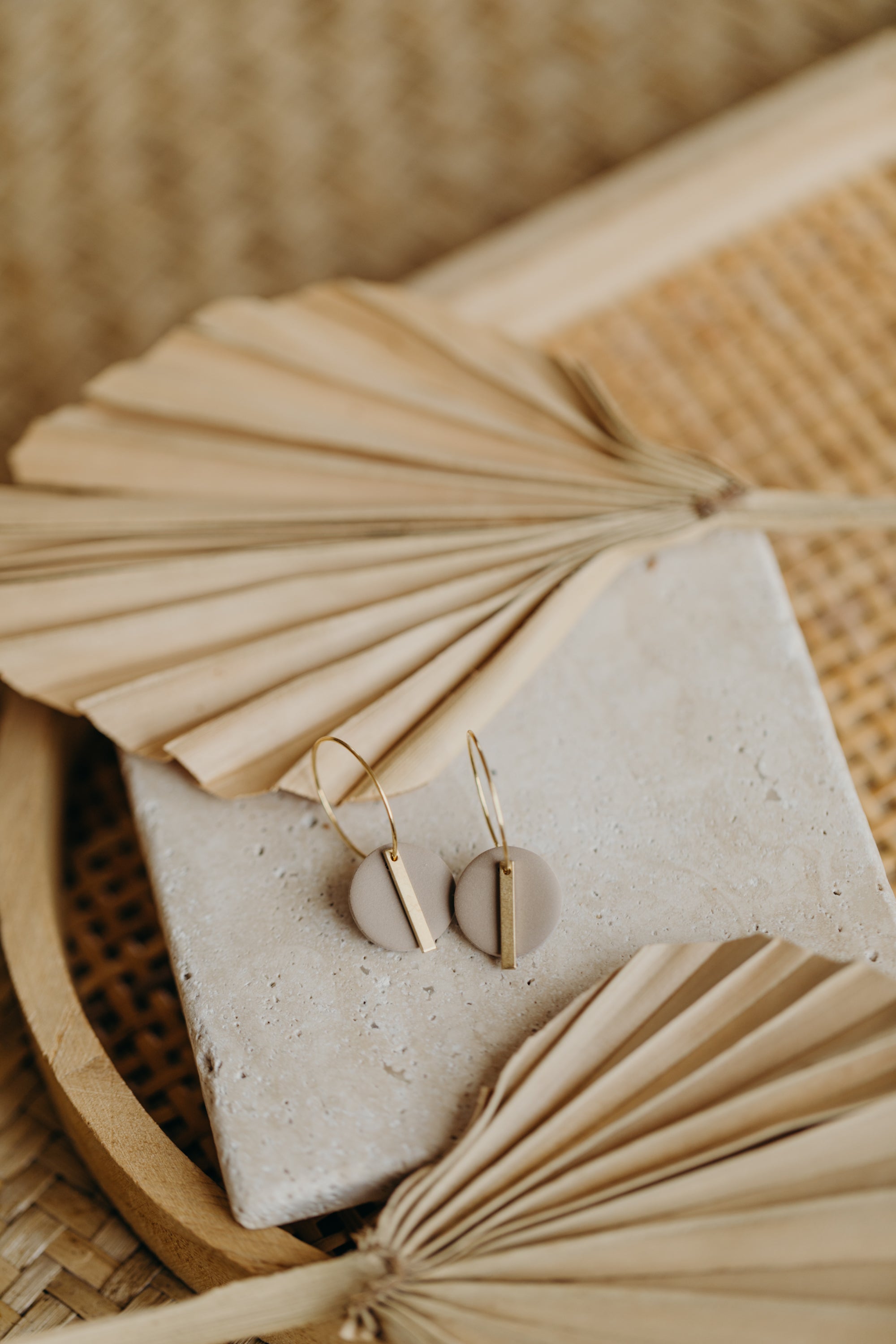 Hoop earrings with round polymer clay pendant and leaf