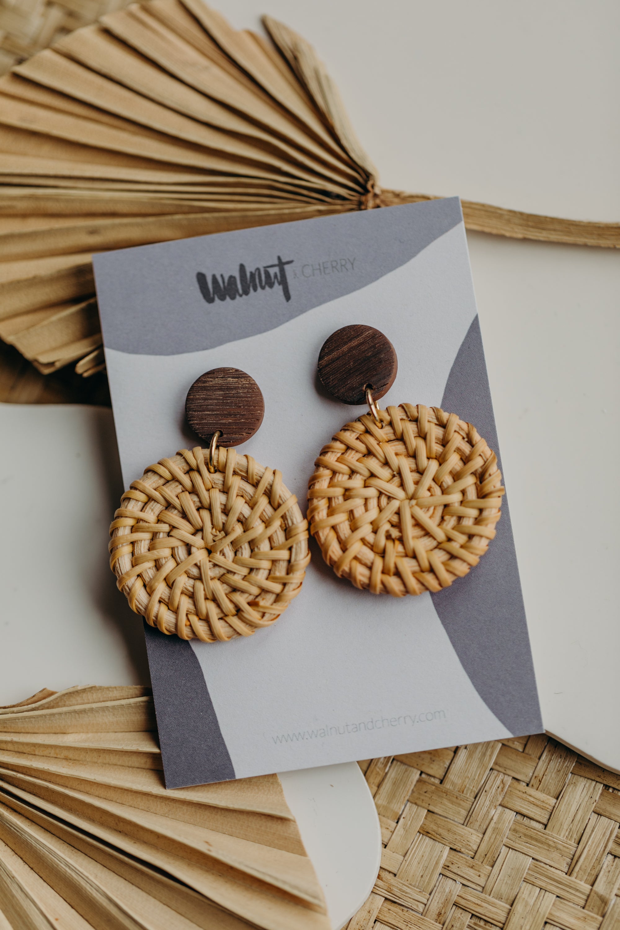blue polymer clay earrings with round rattan pendant