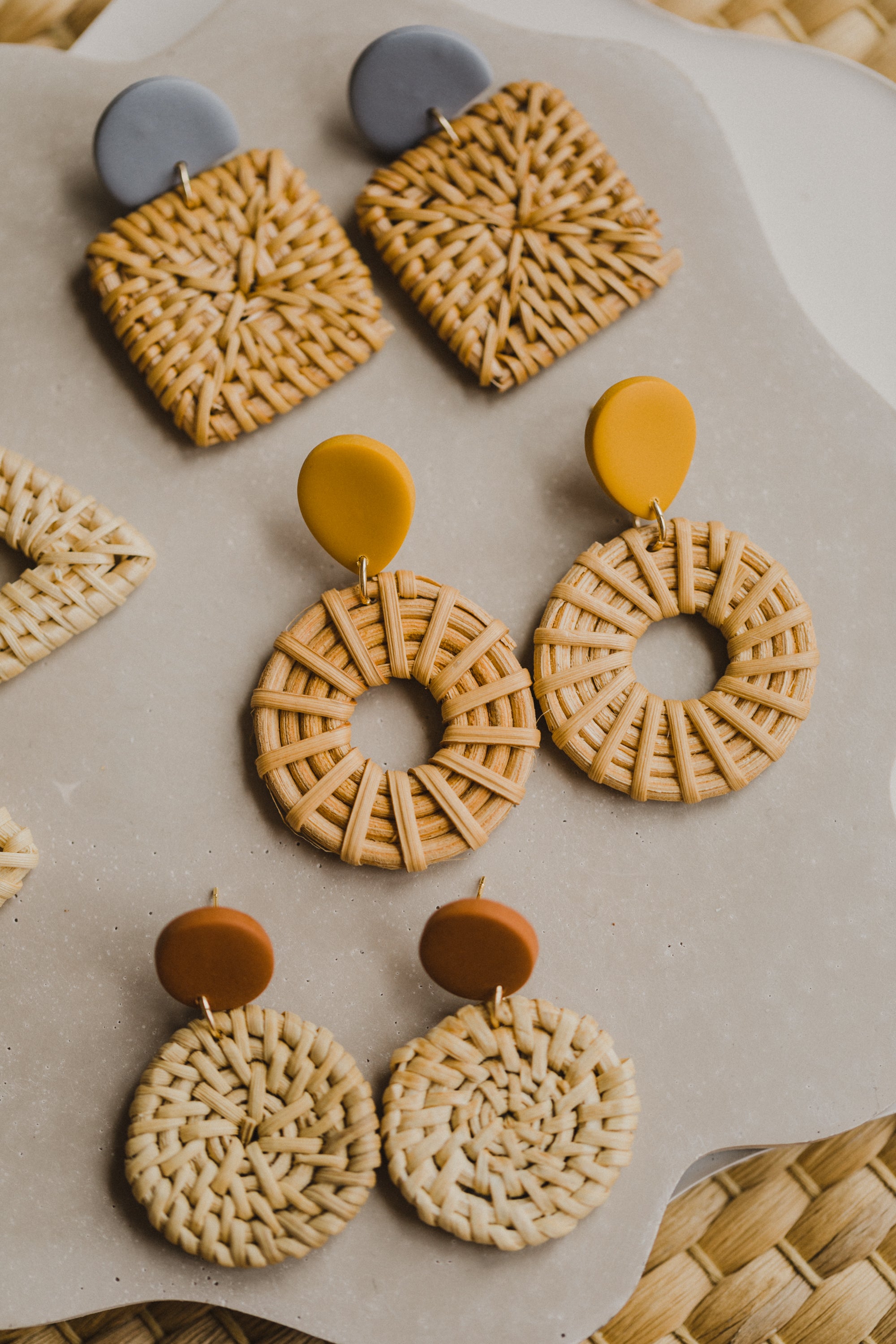 round polymer clay earrings in mustard yellow with rattan pendant circle