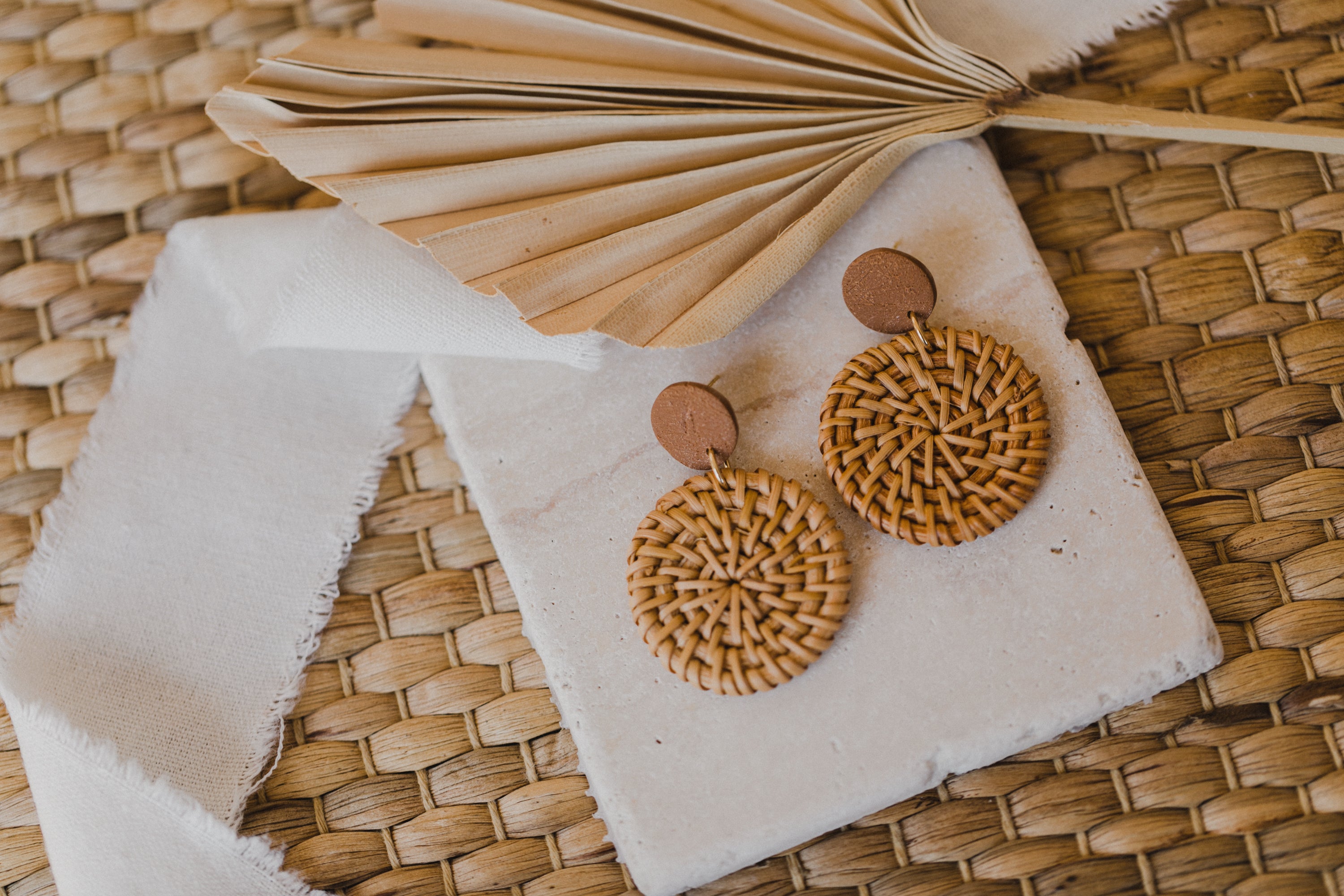 round brown polymer clay earrings with round rattan pendant