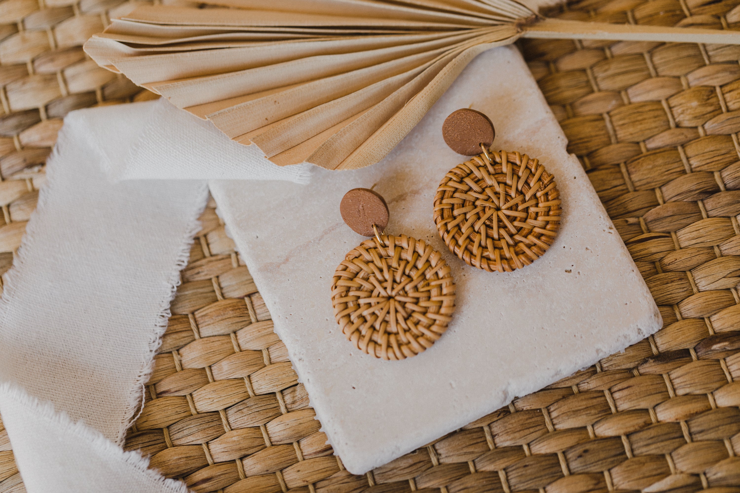 round brown polymer clay earrings with round rattan pendant