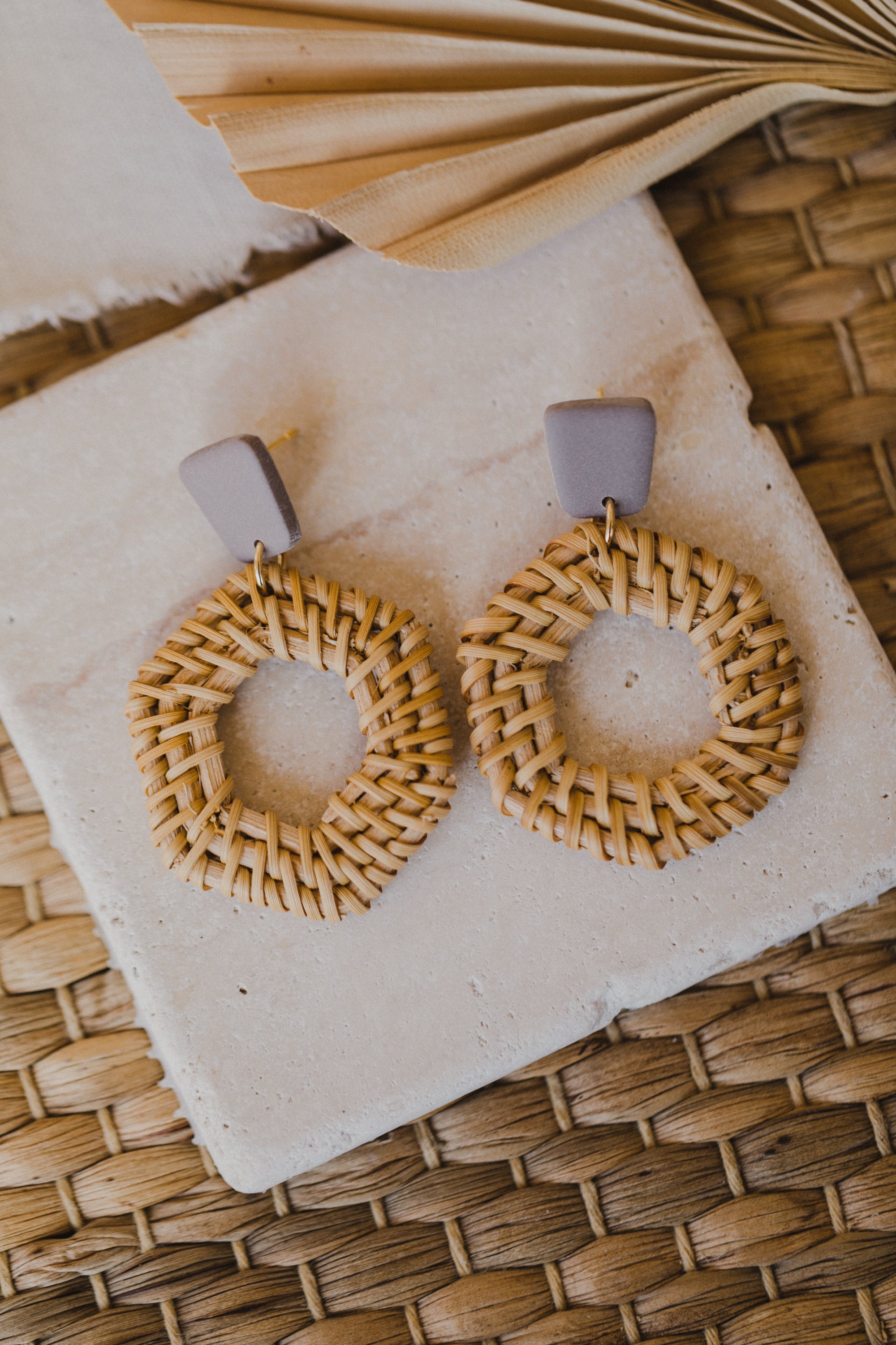 square polymer clay earrings in the color gray-purple with rattan pendant hexagon