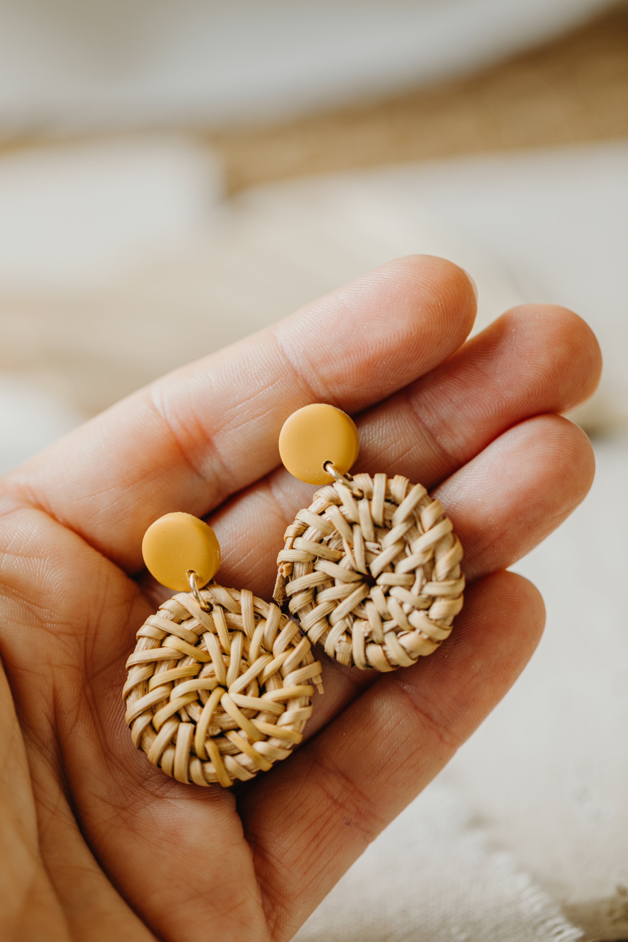 round polymer clay earrings in mustard yellow with round rattan pendant