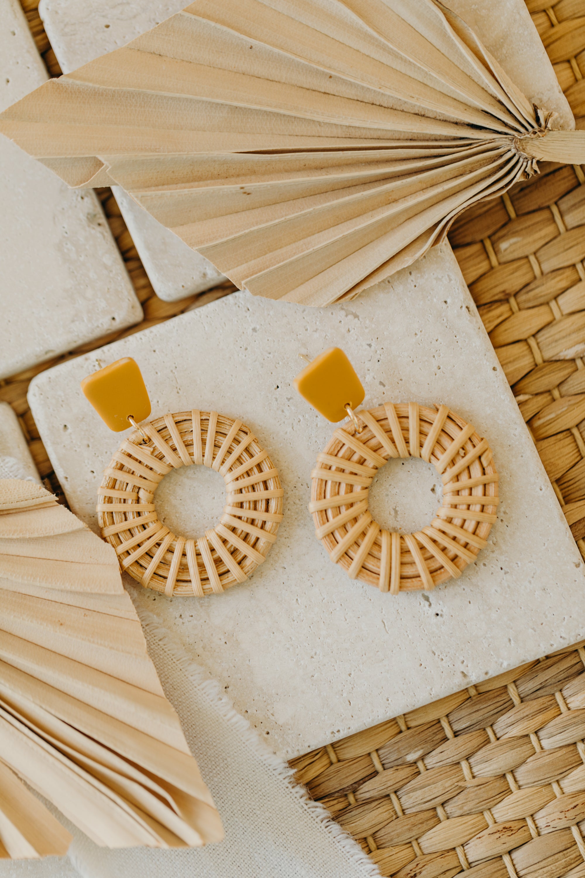rectangular polymer clay earrings in the color mustard yellow with rattan pendant circle
