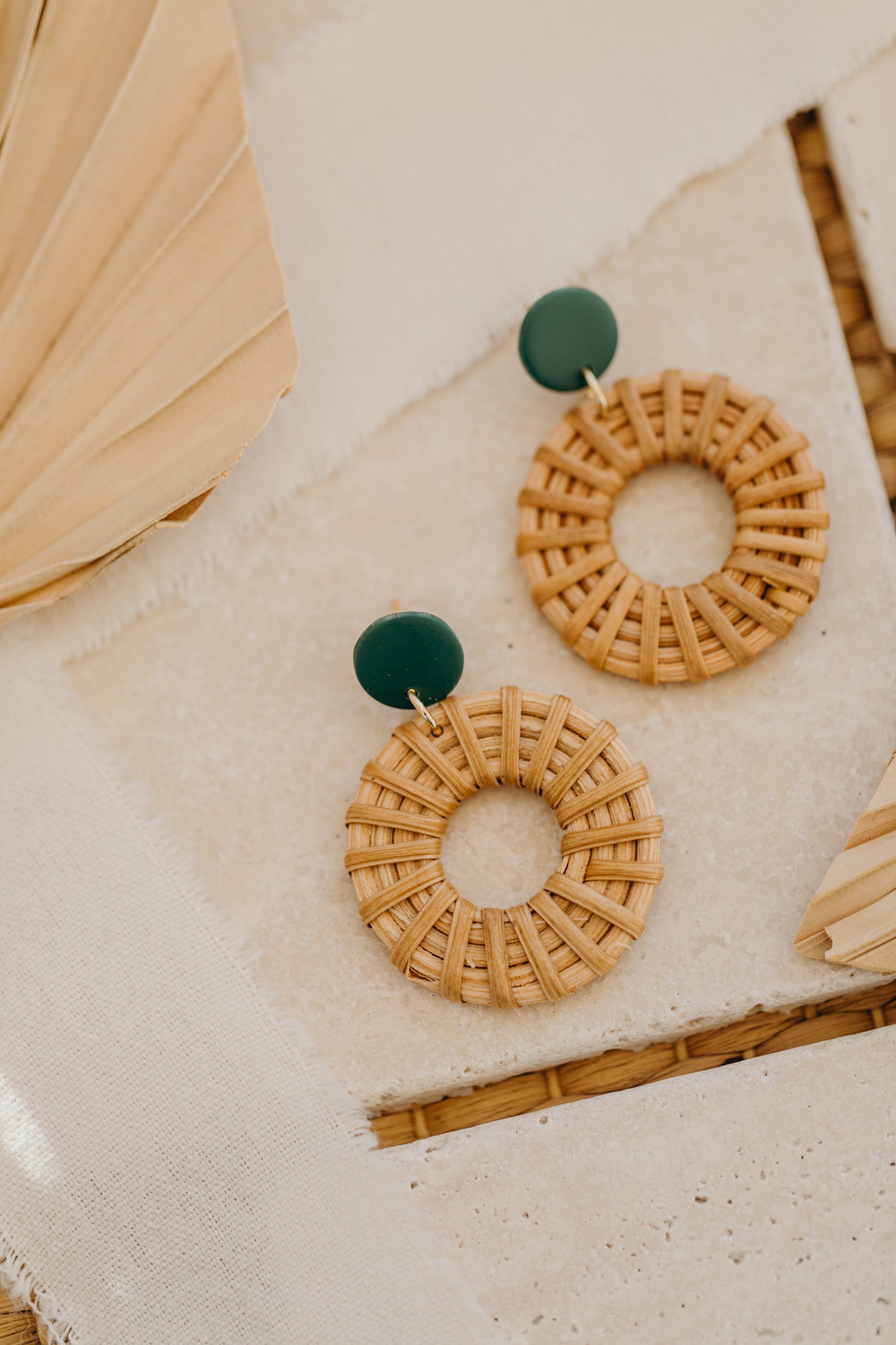 round polymer clay earrings in dark green with rattan pendant circle