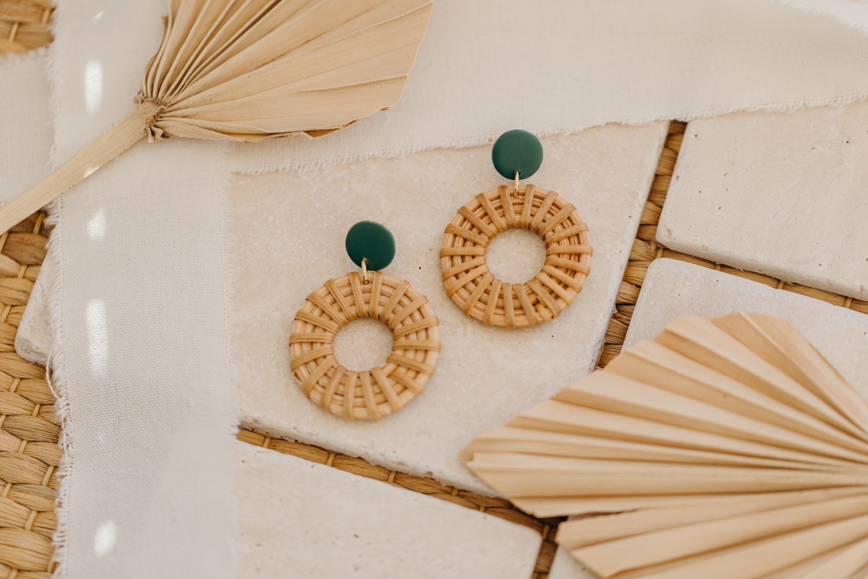 round polymer clay earrings in dark green with rattan pendant circle