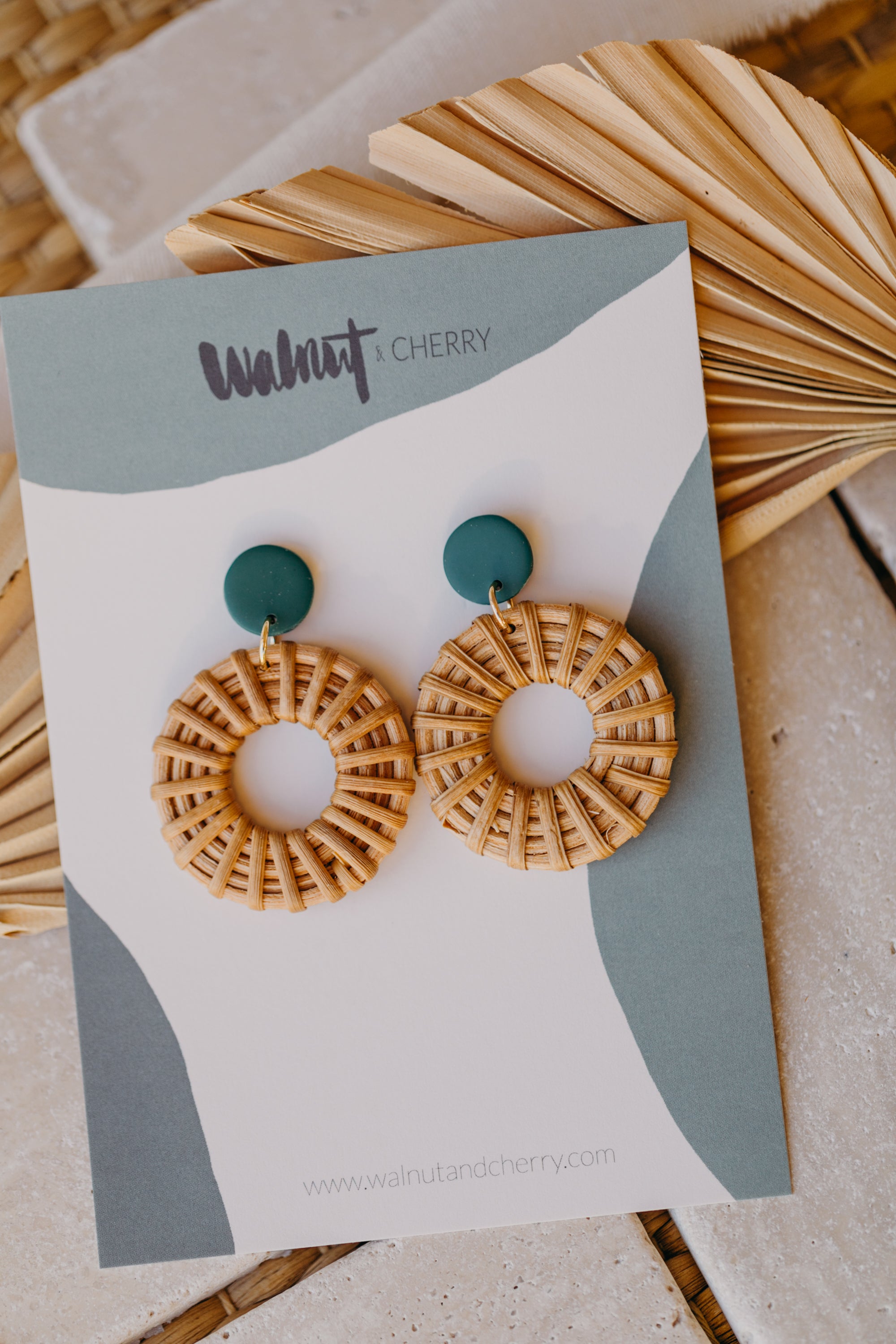 round polymer clay earrings in dark green with rattan pendant circle